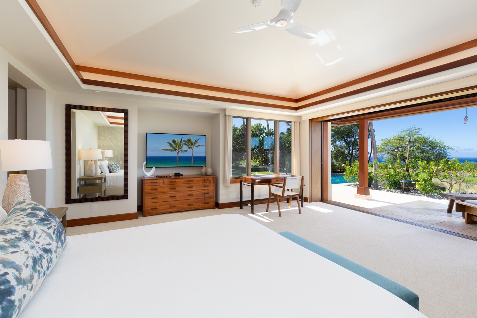 Kailua Kona Vacation Rentals, 4BD Hainoa Estate (102) at Hualalai Resort - Primary bedroom suite with a king bed, smart TV, walk-in closet, distinct lanai, & en suite bath