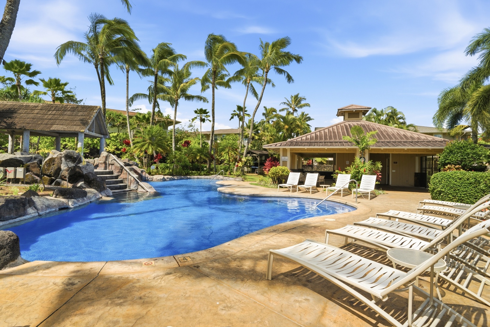 Princeville Vacation Rentals, Hale Kaua'i - Spend sunny afternoons lounging by the water in this beautifully landscaped setting.