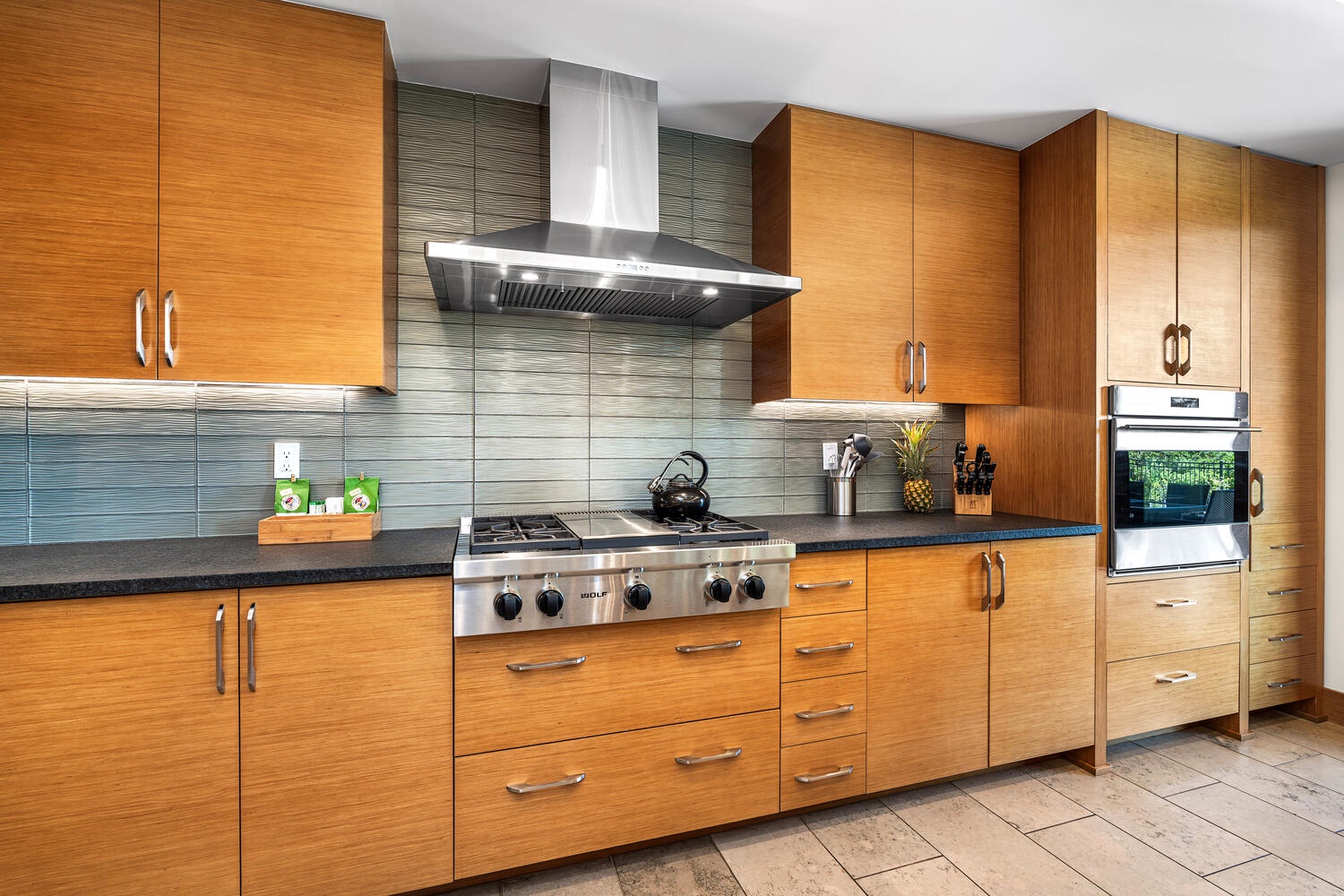 Kamuela Vacation Rentals, Laule'a at the Mauna Lani Resort #14 - Sleek wood cabinetry and stainless appliances bring function and style to the gourmet kitchen.