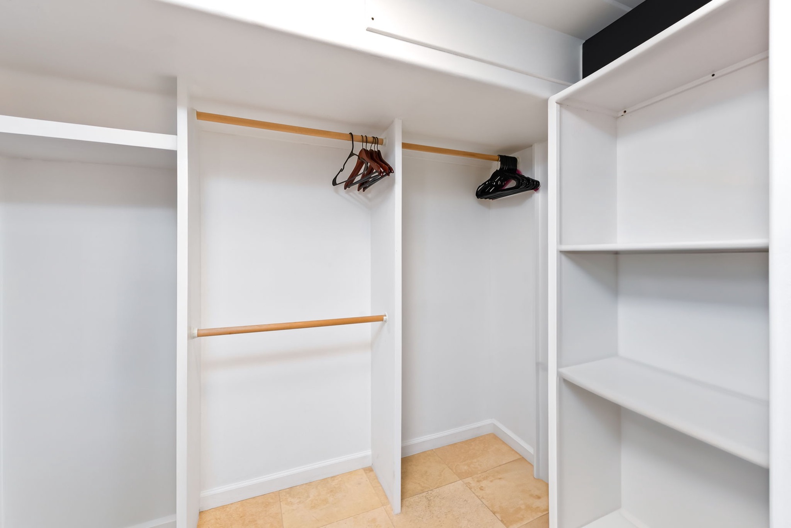 Honolulu Vacation Rentals, Kaimana Beach Penthouse - Walk-in closet with ample storage and shelving, perfect for keeping your belongings organized during an extended stay