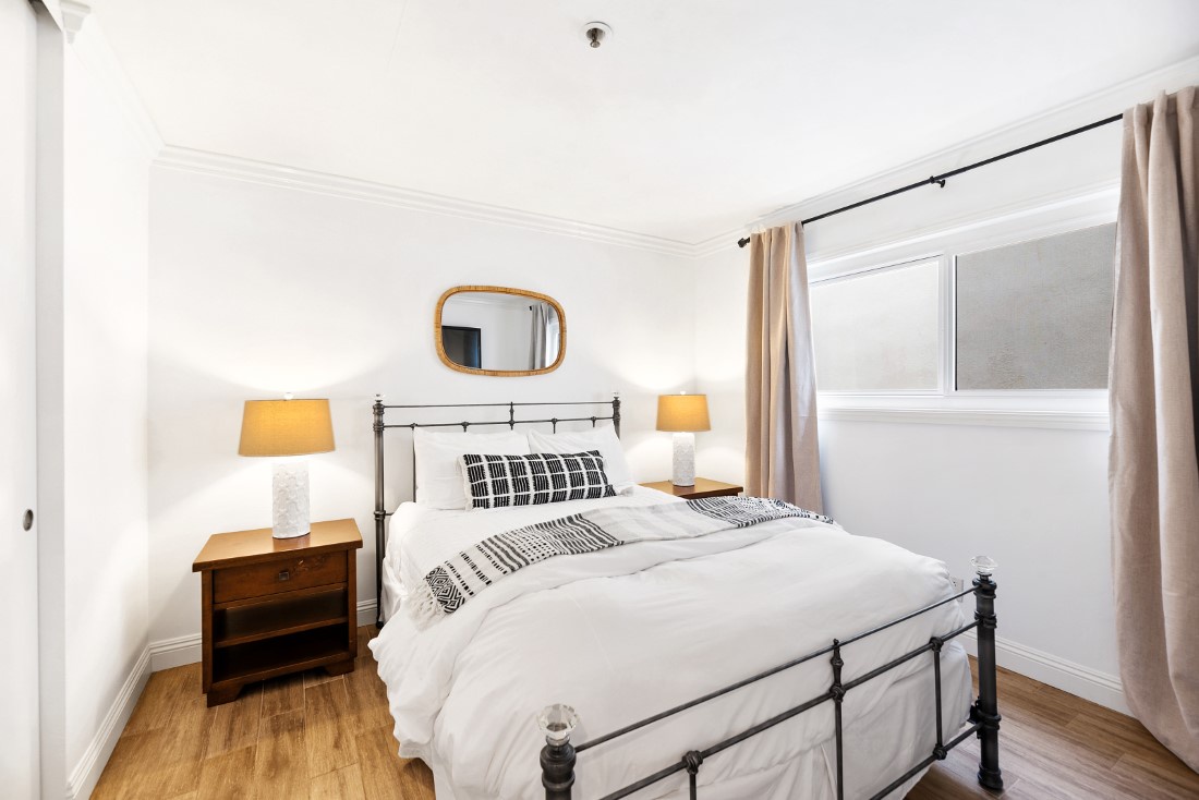 La Jolla Vacation Rentals, Oceanfront La Jolla Cove Condo - The guest bedroom to the left is fitted with a cozy queen-size bed