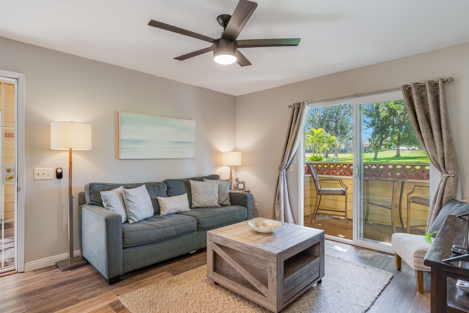 Waikoloa Vacation Rentals, Fairway Terrace F-107 - The couch pulls out to a bed, Linens can be found tucked away inside the coffee table for convince