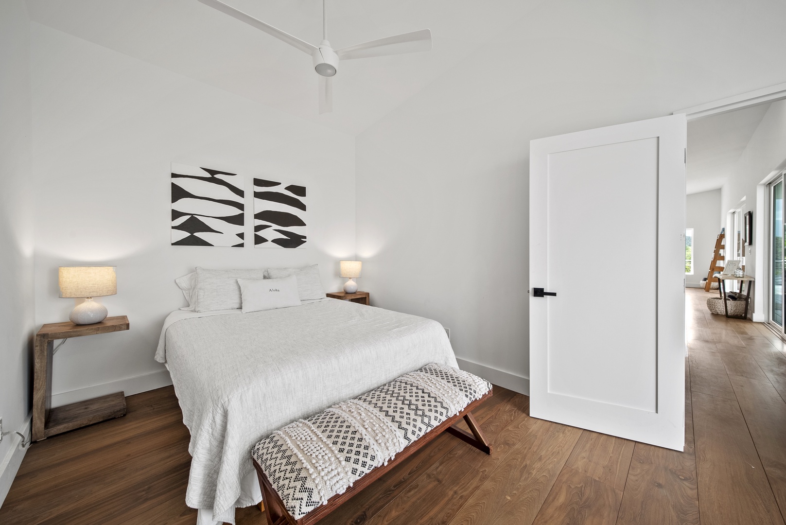 Haleiwa Vacation Rentals, Villa Bianca - The minimalist-style guest suite upstairs with a cozy queen bed for restful nights.