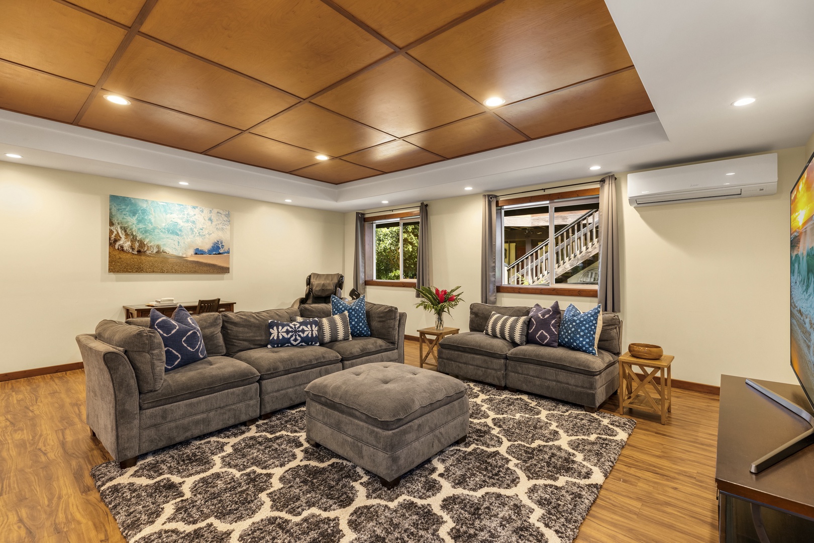 Haleiwa Vacation Rentals, Waimea Dream - A second living space downstairs offers split air conditioning, a large-screen television, a massage chair, and a desk.