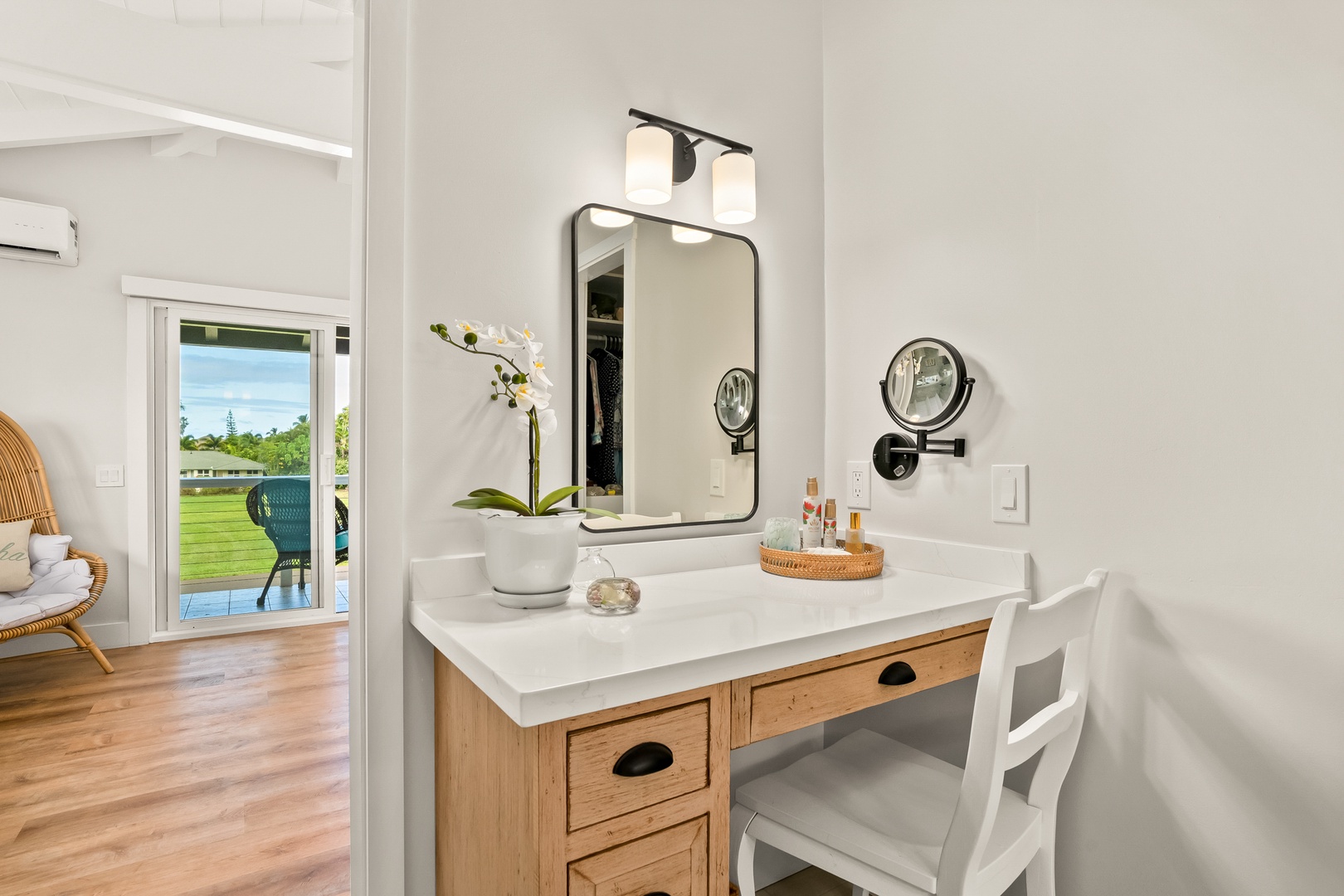 Princeville Vacation Rentals, Ola Hou - Entire Property - A spa-like bathroom featuring a dual-sink vanity, sleek fixtures, and a spacious glass-enclosed shower.