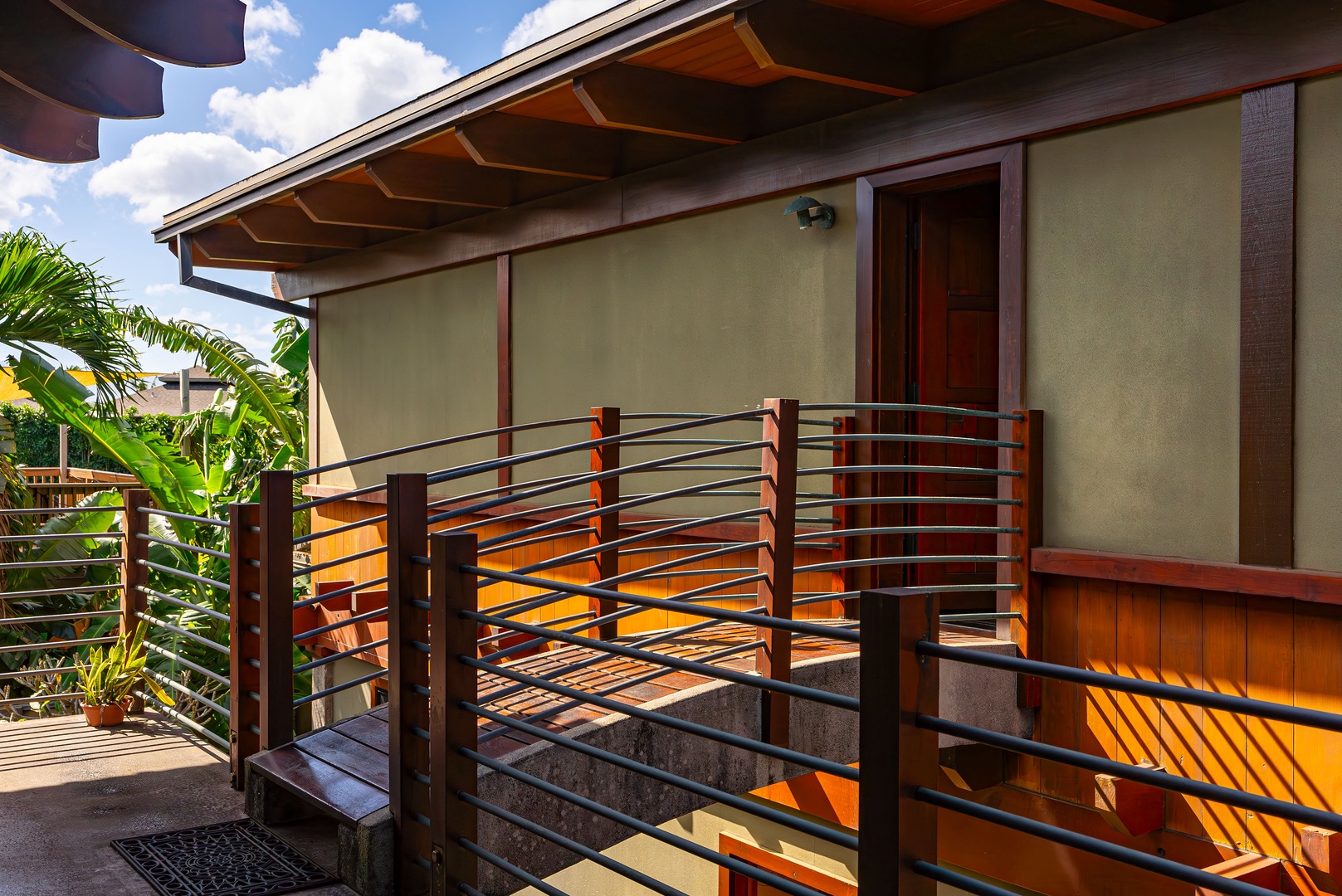 Haleiwa Vacation Rentals, Samurai House - Elevated walkway with a modern railing connecting to the main house.