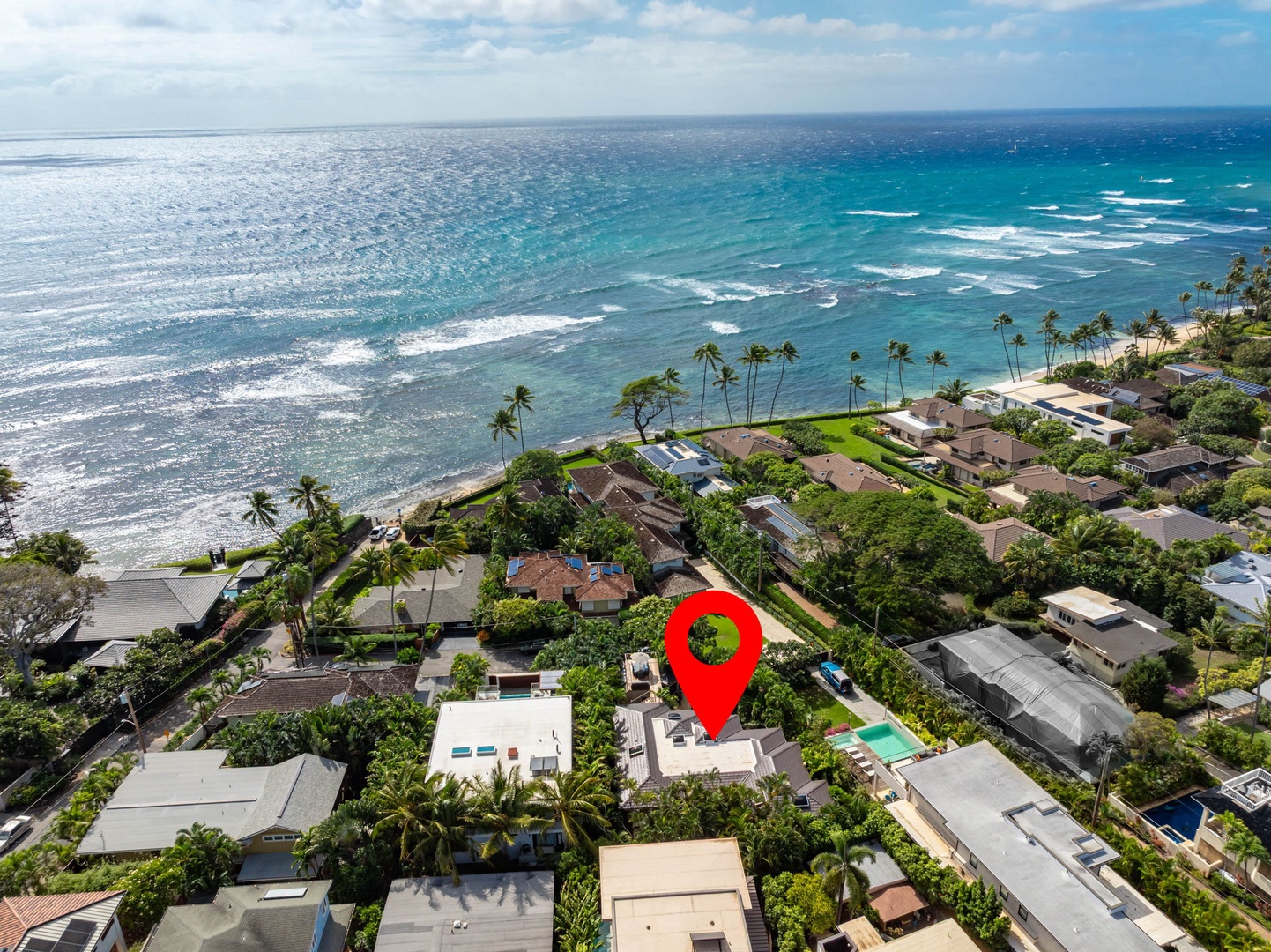Honolulu Vacation Rentals, Diamond Head Luxe - Stunning aerial view showcases the property's prime location with pristine turquoise waters and sandy shore nearby.