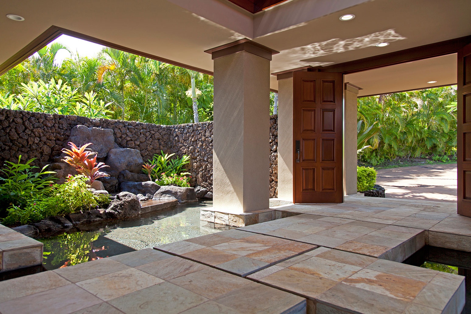 Kamuela Vacation Rentals, 4BD Champion Ridge (CR10) Estate Home at Mauna Lani Resort - Grand entrance with pond and waterfall features and lush landscaping.