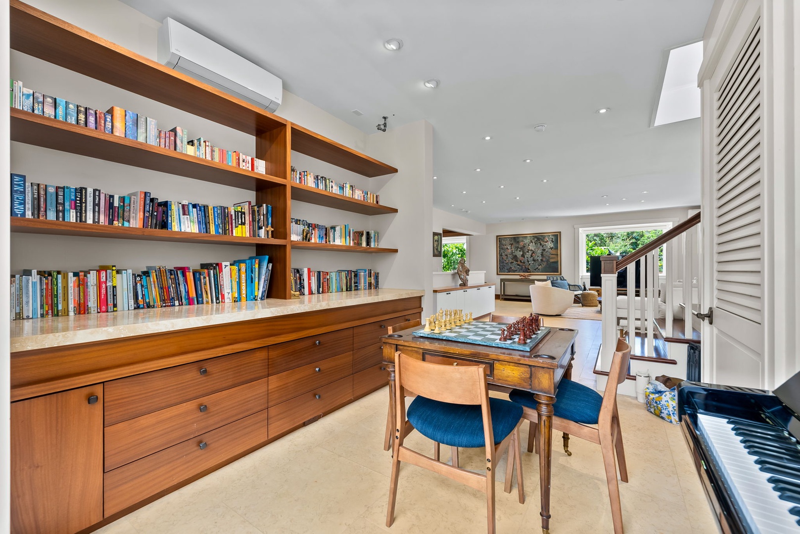 Kailua Vacation Rentals, Leaf House - This bright reading and game room invites you to unwind with a book, challenge friends to chess, or relax by the piano in elegant, light-filled comfort.