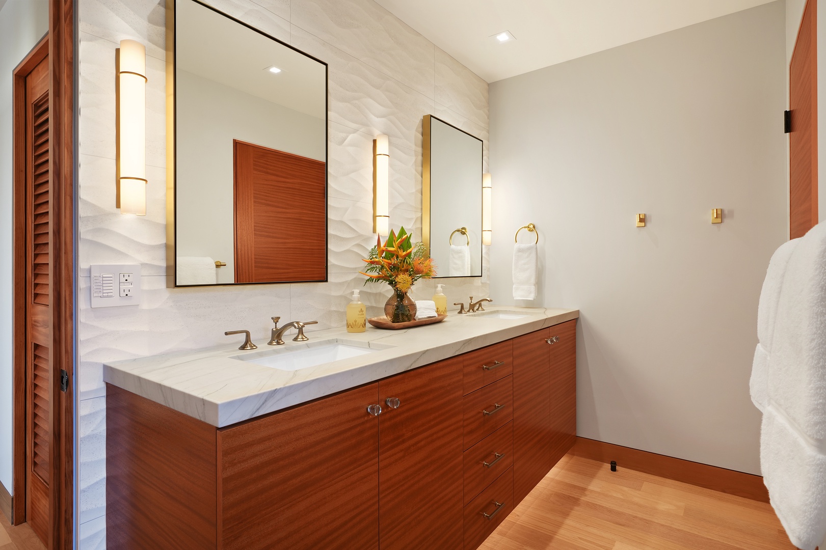 Koloa Vacation Rentals, Hale Kai'Opua - Elegant bathroom with a double vanity and sleek modern finishes.