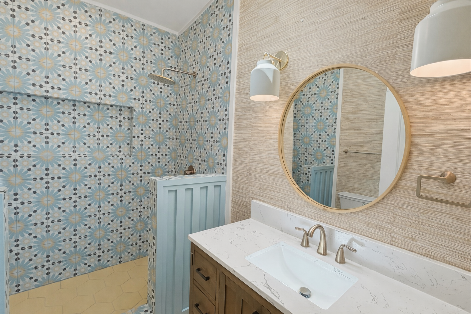 Kailua Vacation Rentals, Kai Nalu - Enjoy a stylishly appointed bathroom featuring gorgeous patterned tile, elegant marble countertops, and brass accents that create a luxurious retreat.