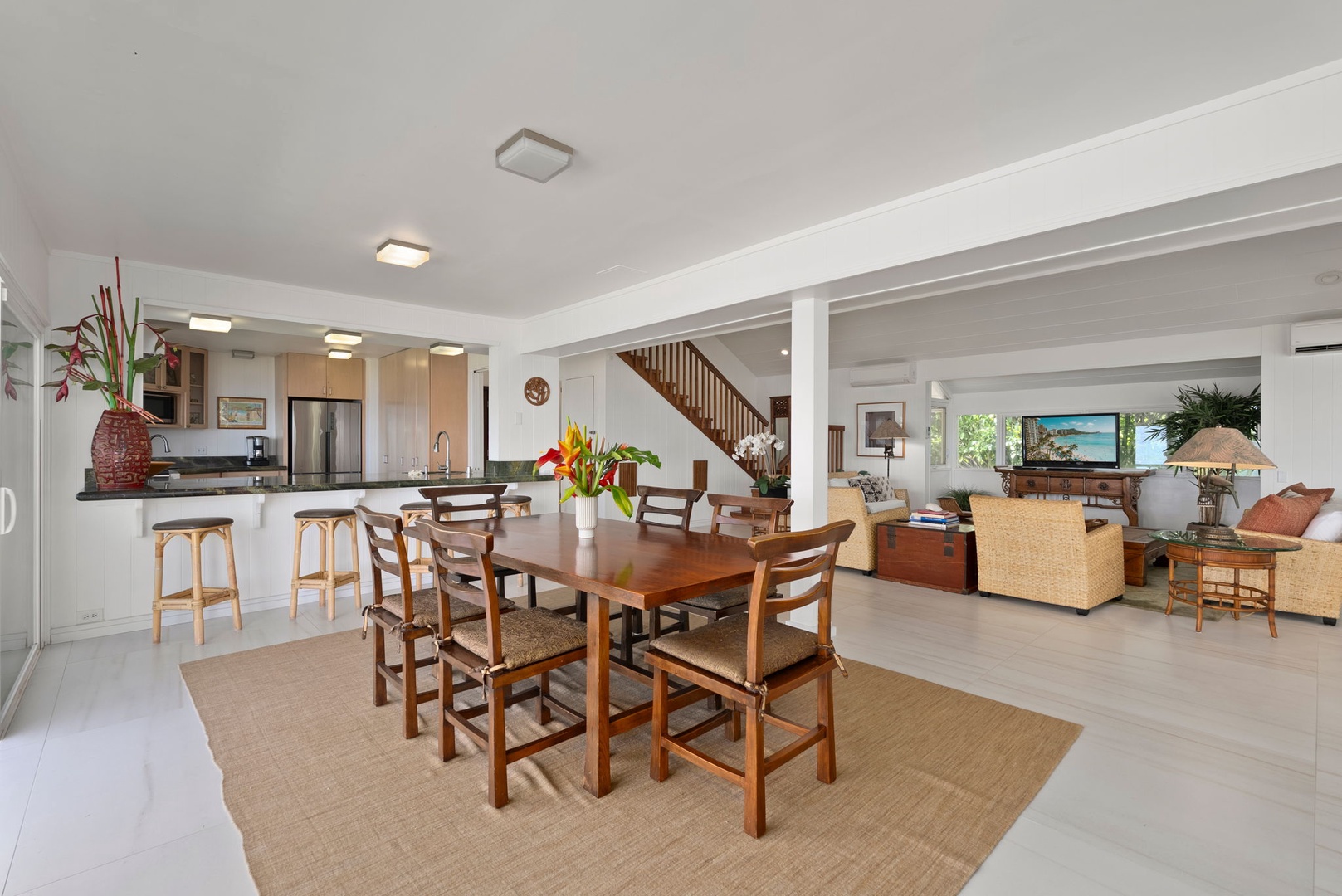 Waianae Vacation Rentals, Ma'ili Blue - Gather around the warm wood dining table where your family meals become cherished memories in this bright, open living space.
