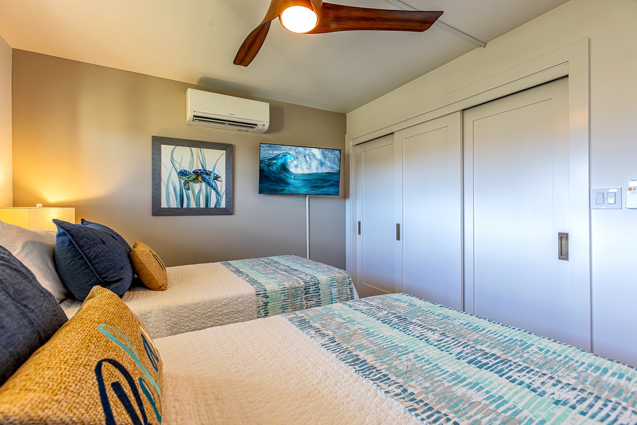 Kihei Vacation Rentals, Kamaole Beach Royal 610 - A wall-mounted AC unit and flatscreen keep this second bedroom cool and entertained on its own terms.