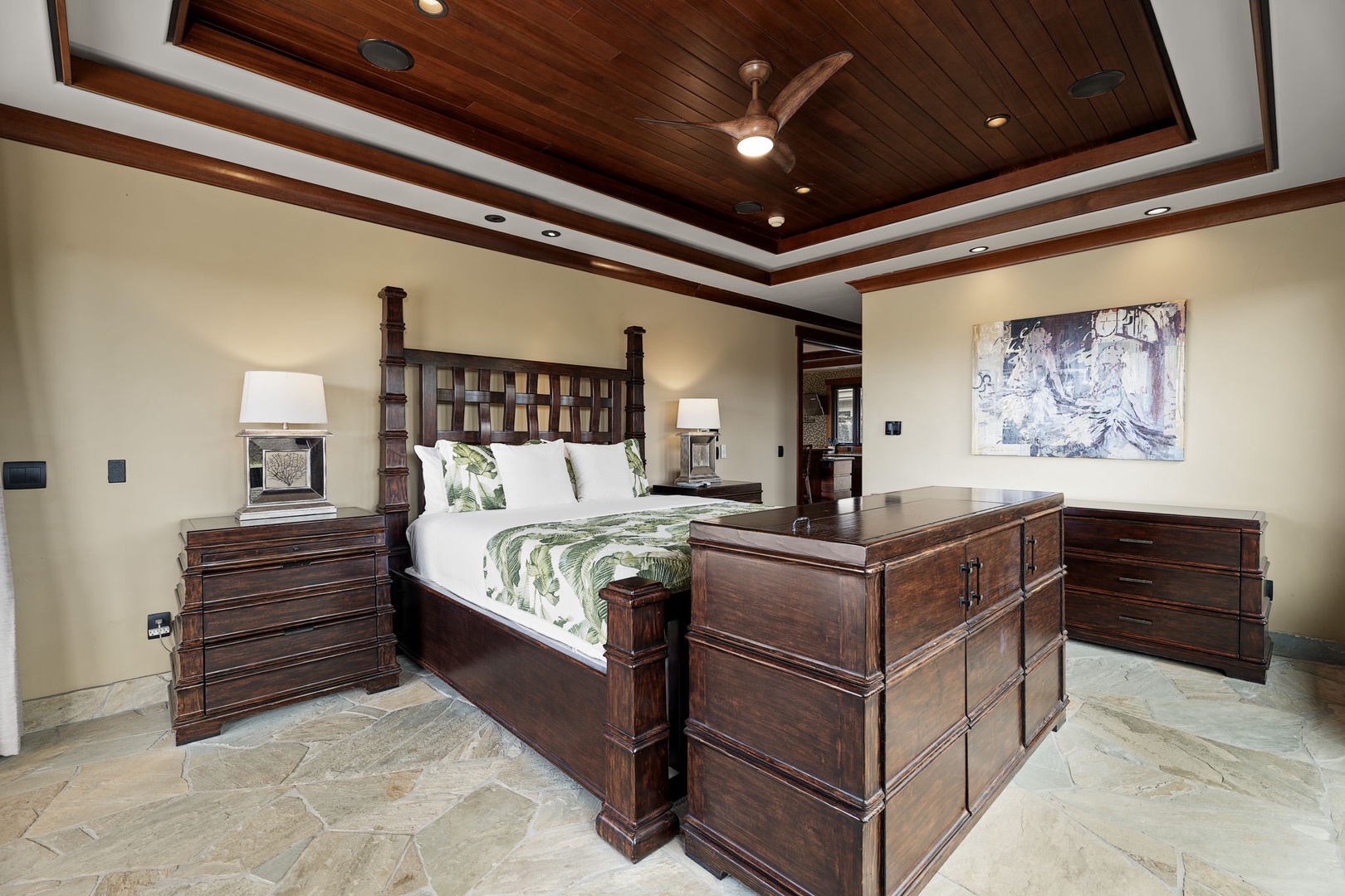 Kamuela Vacation Rentals, Hale Konane - A serene primary suite featuring a king-sized bed, vaulted ceilings, and private lanai access.