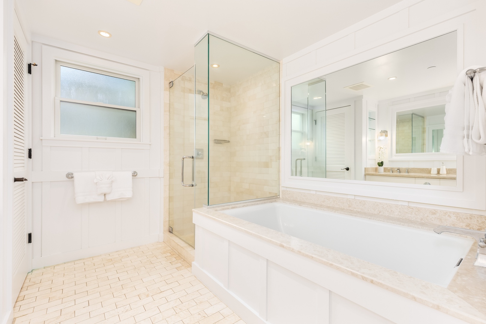 Kahuku Vacation Rentals, Turtle Bay Villas 209 - Luxurious marble bathroom, complete with soaking tub and glass-enclosed shower for the ultimate relaxation experience.
