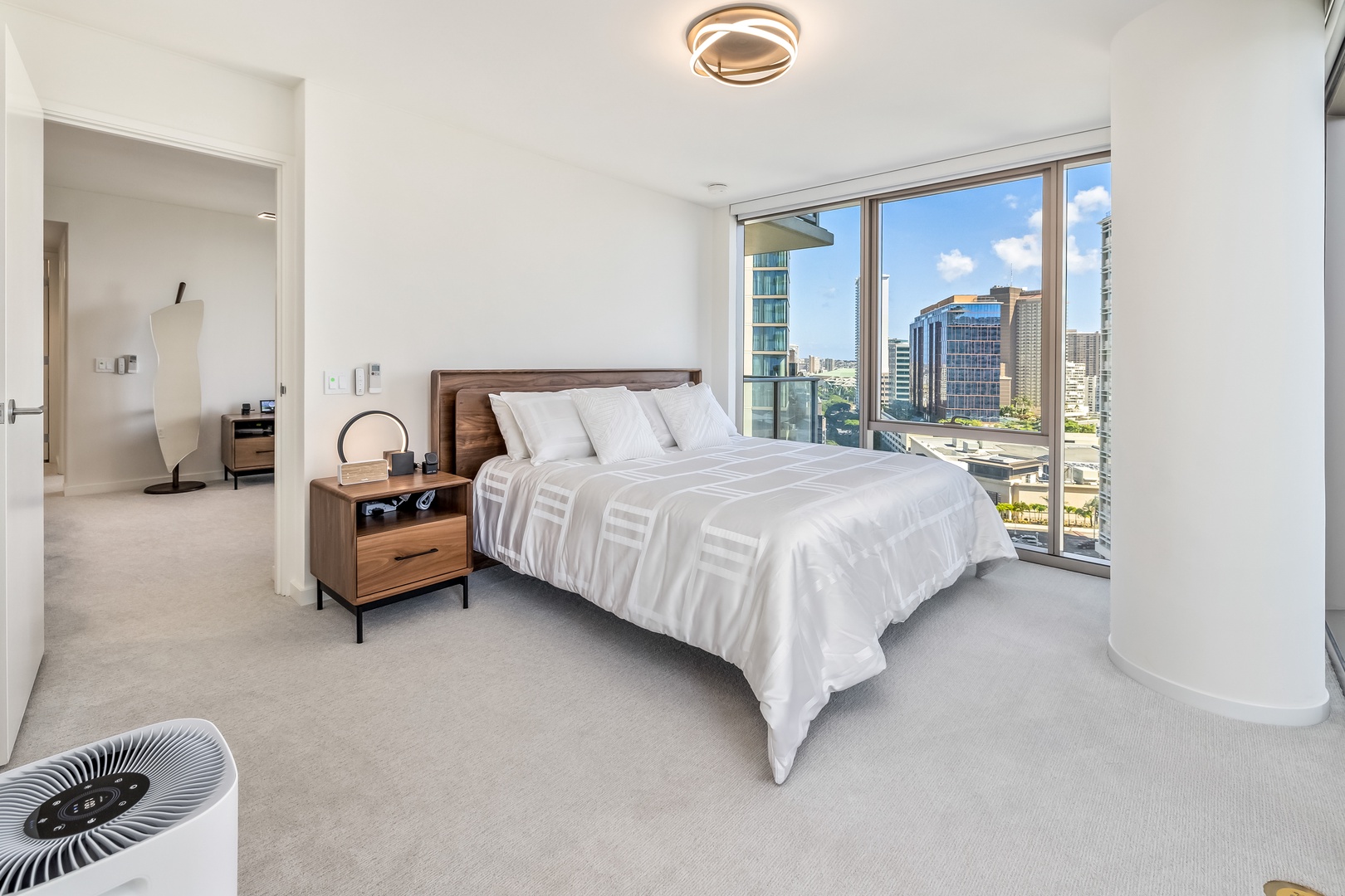 Honolulu Vacation Rentals, Sky Ala Moana #1701 - The primary suite has floor to ceiling glass walls, king-sized bed and split AC.