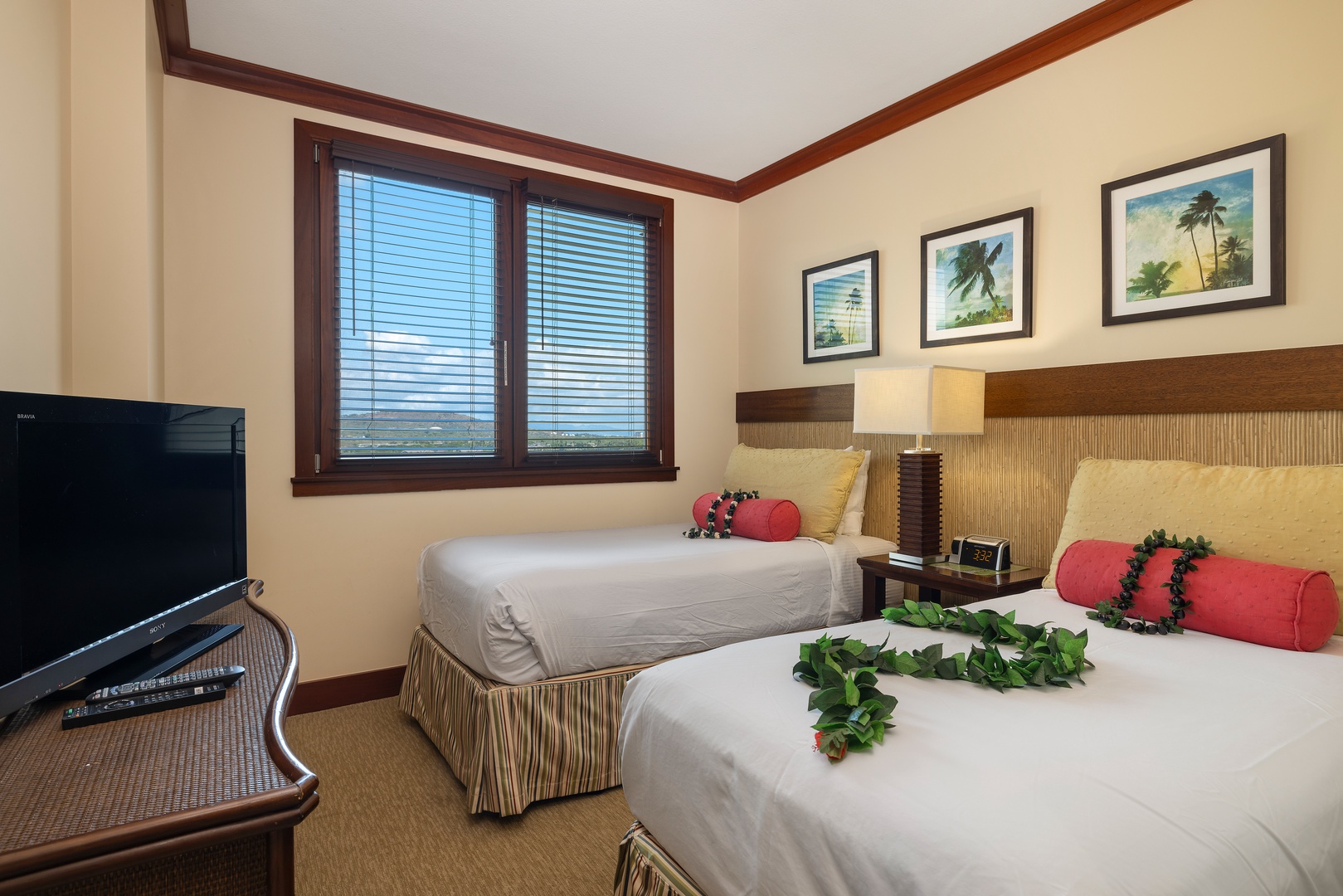 Kapolei Vacation Rentals, Ko Olina Beach Villas O1004 - The second guest bedroom boasts colorful twin beds and island art.