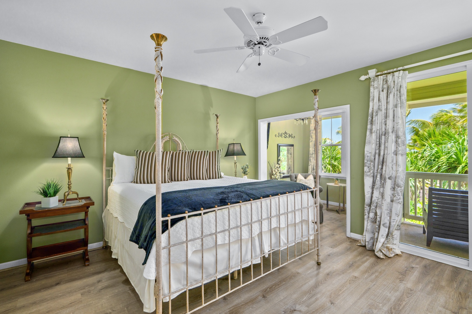 Princeville Vacation Rentals, Kaimana Villa - Drift off peacefully in your charming bedroom with soothing green walls, a vintage four-poster bed, and tropical views from your lanai..