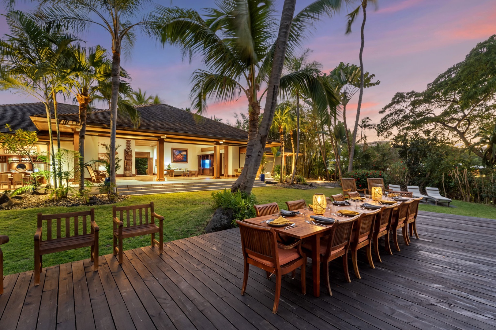 Kailua-Kona Vacation Rentals, Hahalua Bay Villa - Tropical villa with palm-shaded deck featuring elegant outdoor dining beneath a stunning sunset sky.