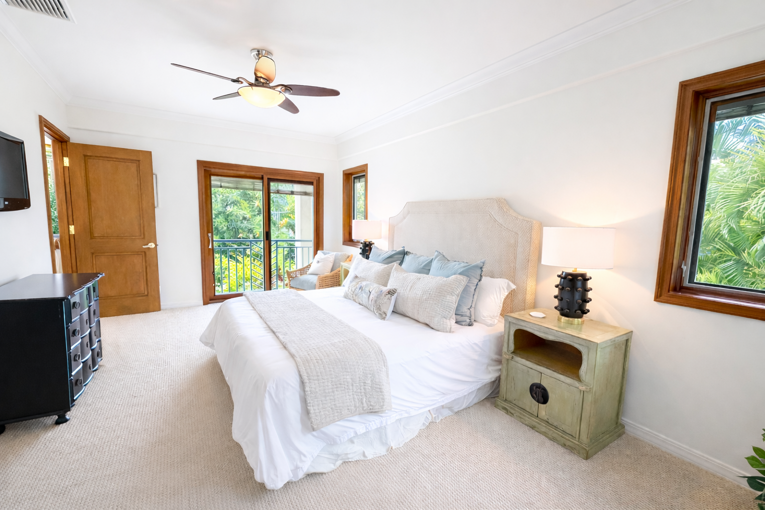 Honolulu Vacation Rentals, Maunalua Estate - Sink into crisp white linens in your serene bedroom, where tropical breezes flow through windows and a ceiling fan keeps you cool.
