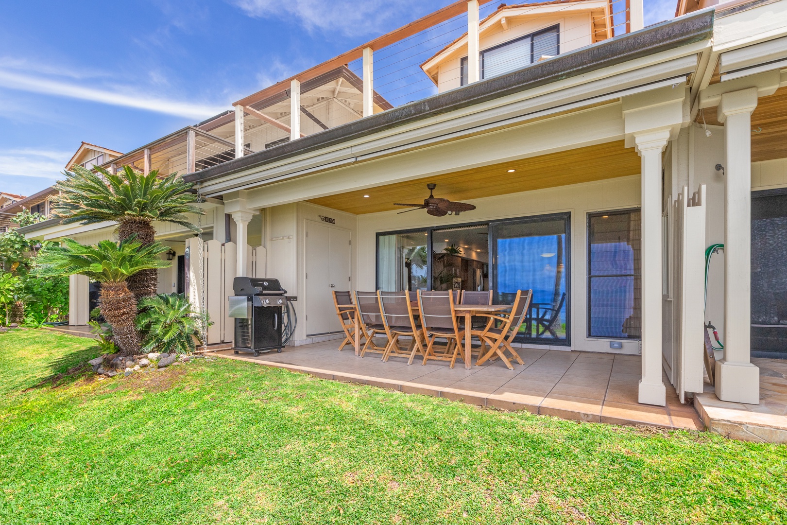 Lahaina Vacation Rentals, Puamana 254-2 - Dine al fresco on Puamana 254-2’s lanai with seating for eight and tropical garden views.