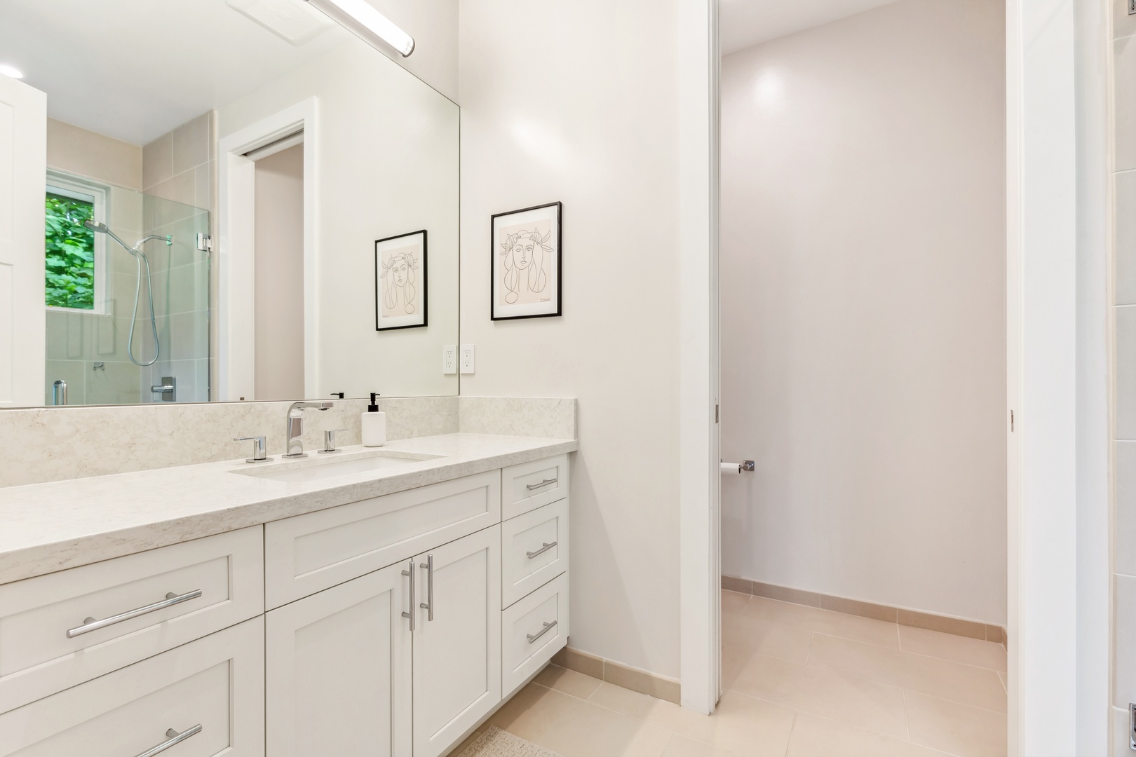 Laie Vacation Rentals, Majestic Mahakea Oceanfront Oasis - Spacious bathroom with clean finishes and modern fixtures throughout.