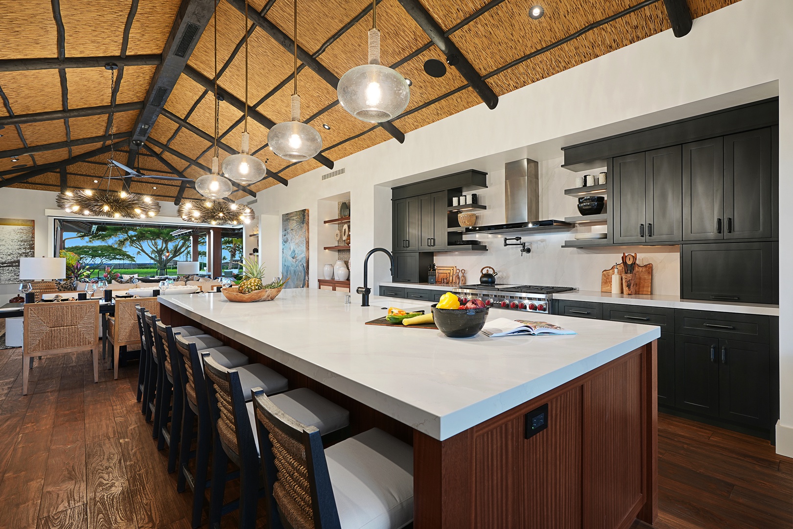 Koloa Vacation Rentals, Hale Pakika at Kukui'ula - A chef's haven with a spacious island, state-of-the-art appliances, and sleek breakfast bar for unforgettable dining experiences.