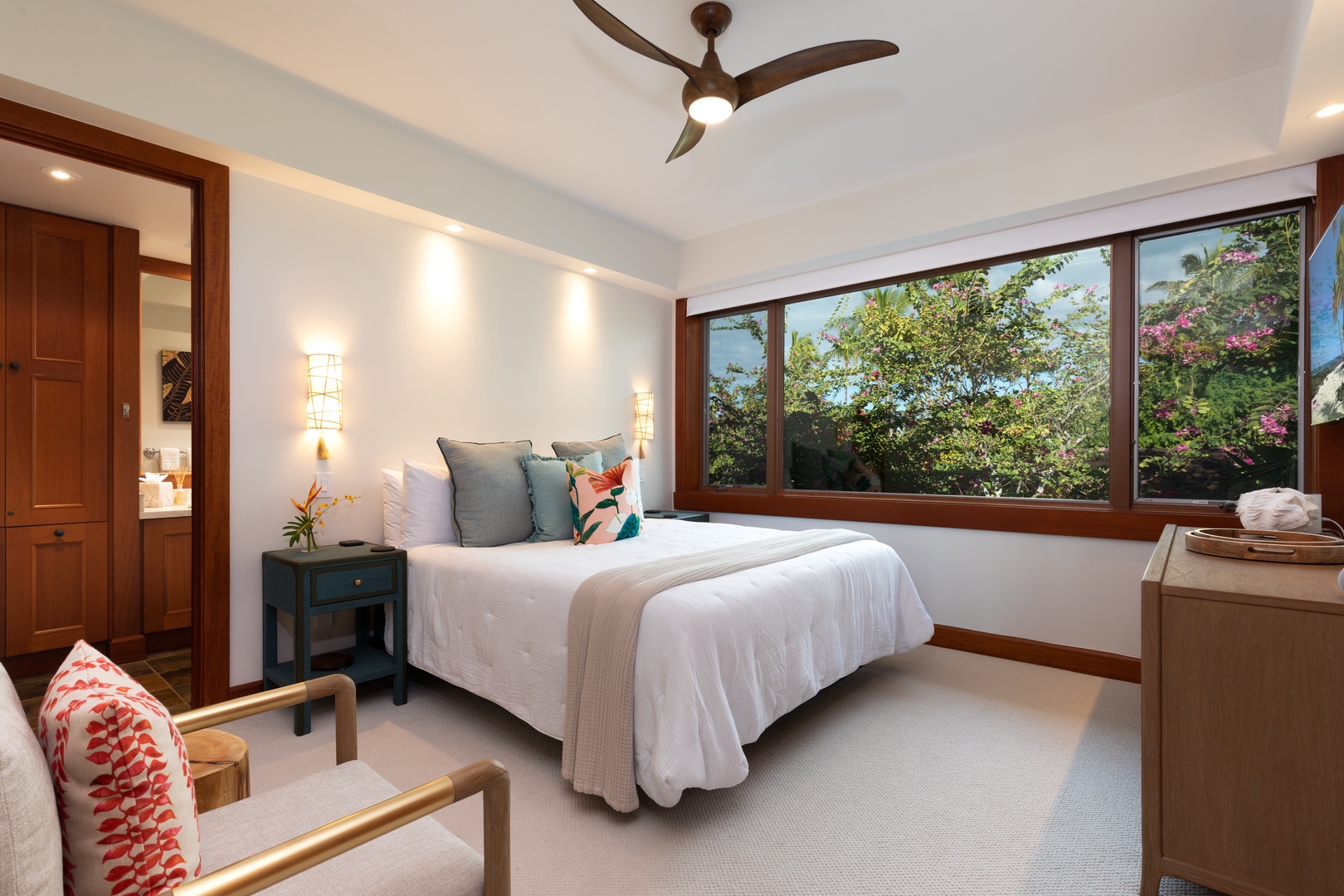 Kailua Kona Vacation Rentals, 3BD Waiulu Villa 111D at Hualalai Resort - Inviting guest bedroom with a Cal-King bed, cozy seating, and tropical accents.