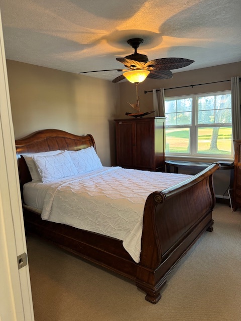 Princeville Vacation Rentals, Pili Aloha - Second bedroom with a queen-size bed and elegant design.