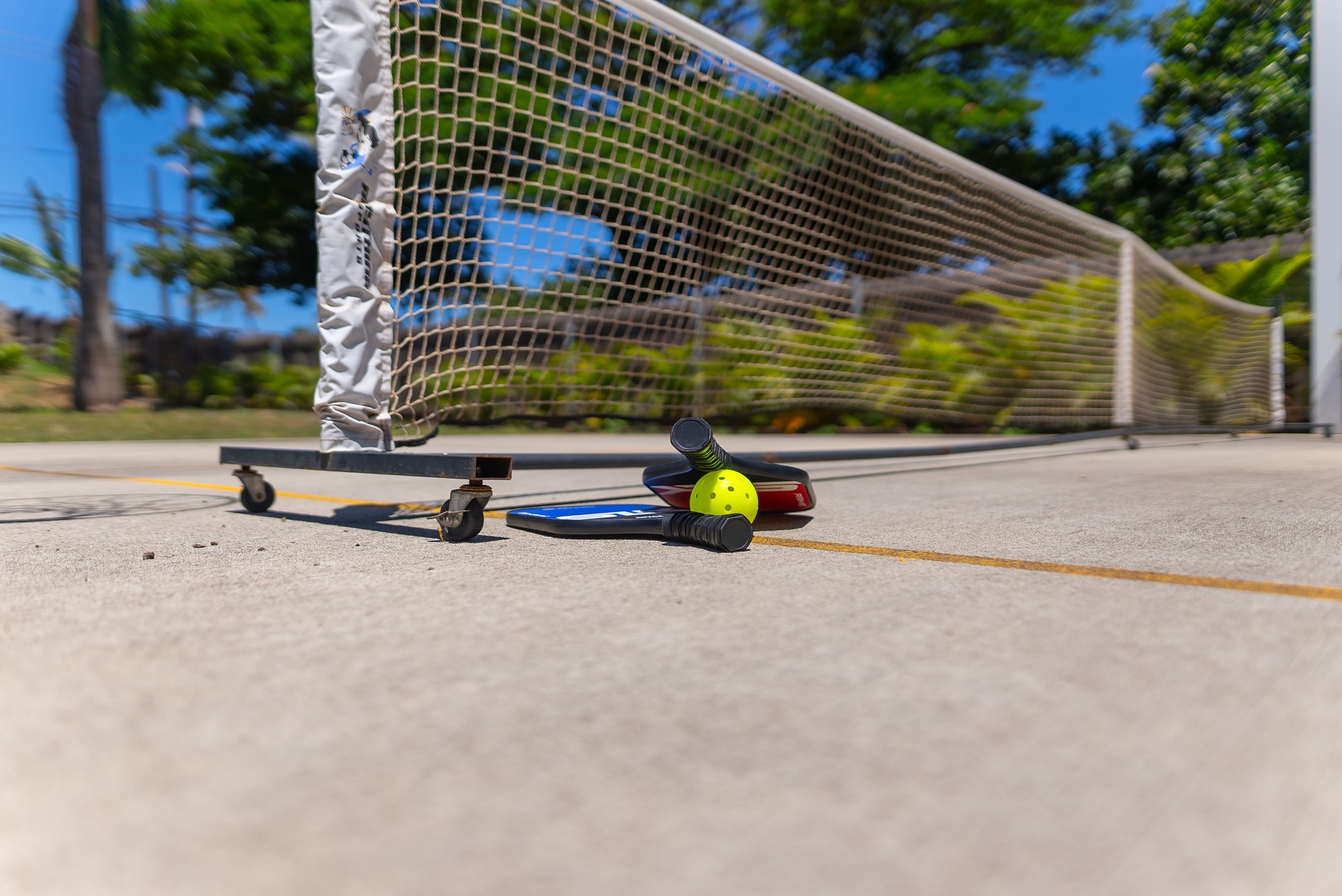 Haleiwa Vacation Rentals, Sunset Beach Island Retreat - Pause for a game or practice your skills at this outdoor pickleball court, complete with all you need for a fun and active day.