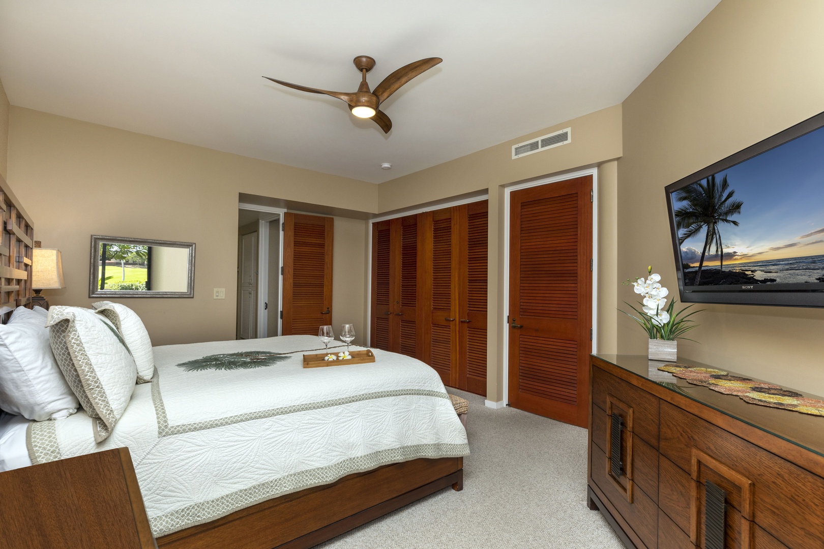 Kamuela Vacation Rentals, Mauna Lani Point E105 - The primary suite includes two oversized closets and a private en-suite bath.