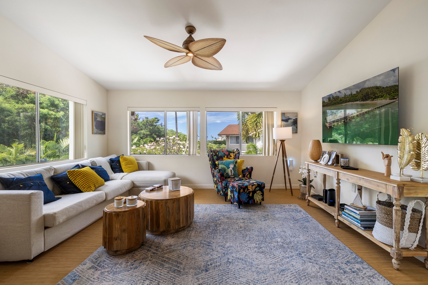 Unwind in your bright living space with tropical views and cozy seating perfect for relaxation.