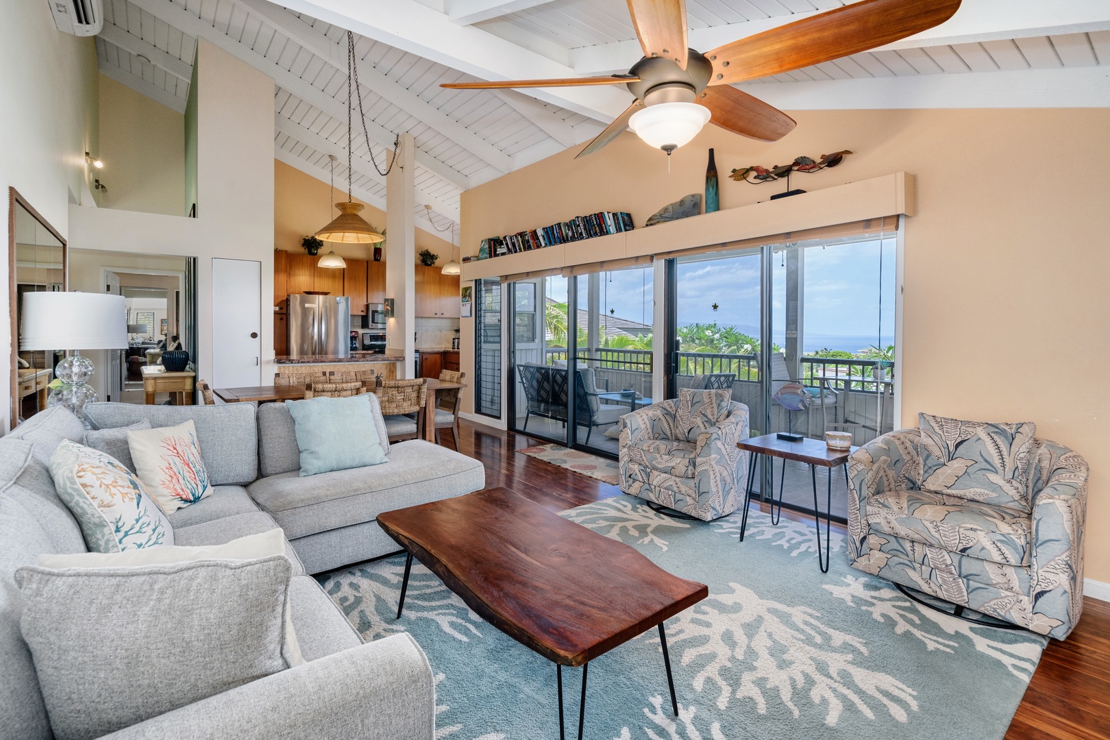 Kihei Vacation Rentals, Wailea Ekolu 204 - The sectional lines up with the open slider, ocean glimpse included whenever the doors slide back.