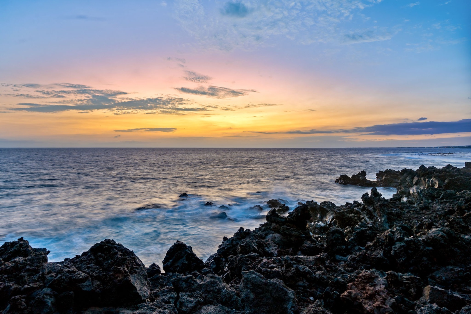 Kailua Kona Vacation Rentals, Keauhou Kona Surf & Racquet 1104 - Pink and gold settle over the lava shore as the last light drops offshore.