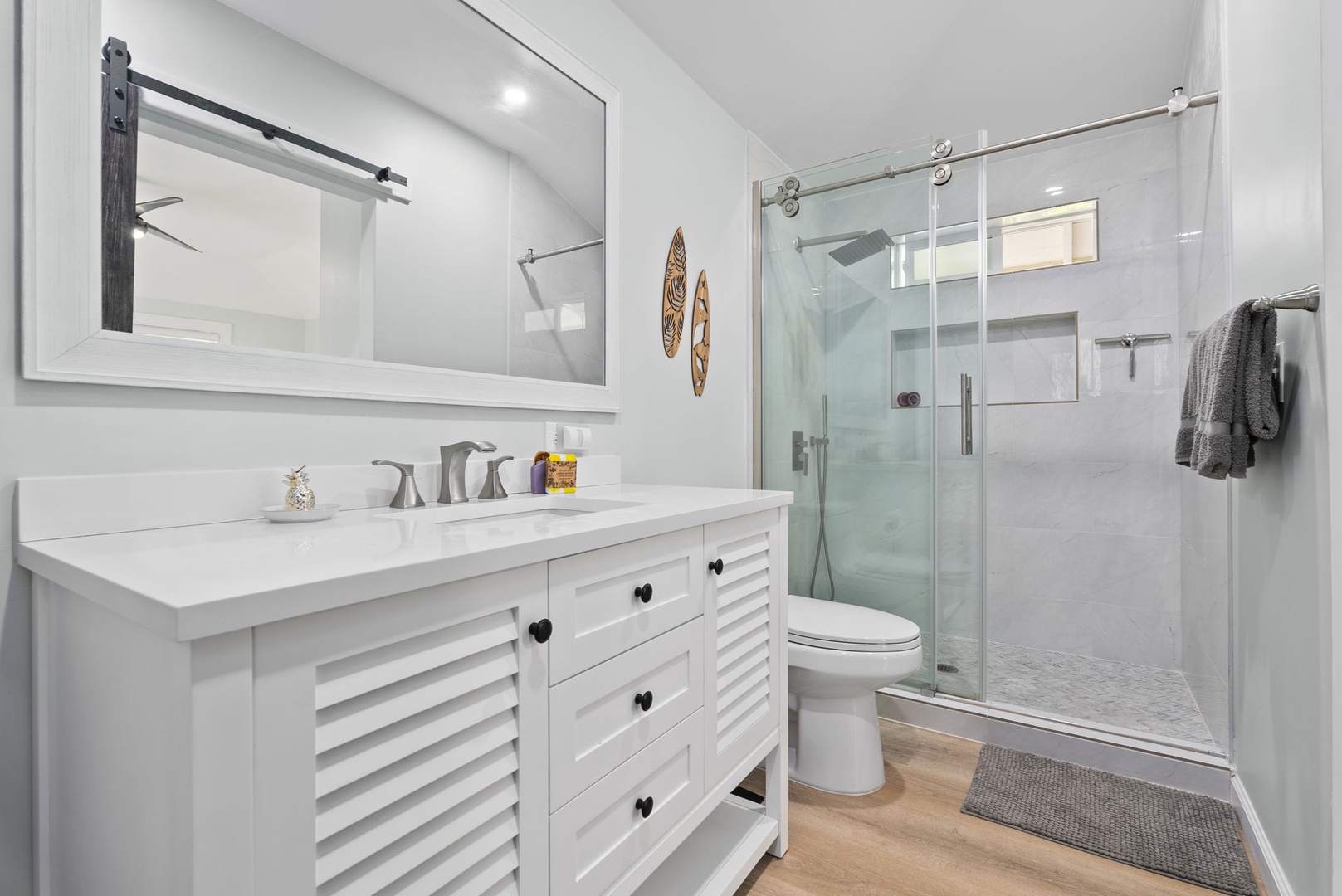 Kailua Vacation Rentals, Hale Alapi'i Lanikai Getaway - Refresh and rejuvenate in this elegantly appointed bathroom, complete with a sleek vanity and a spacious walk-in shower.