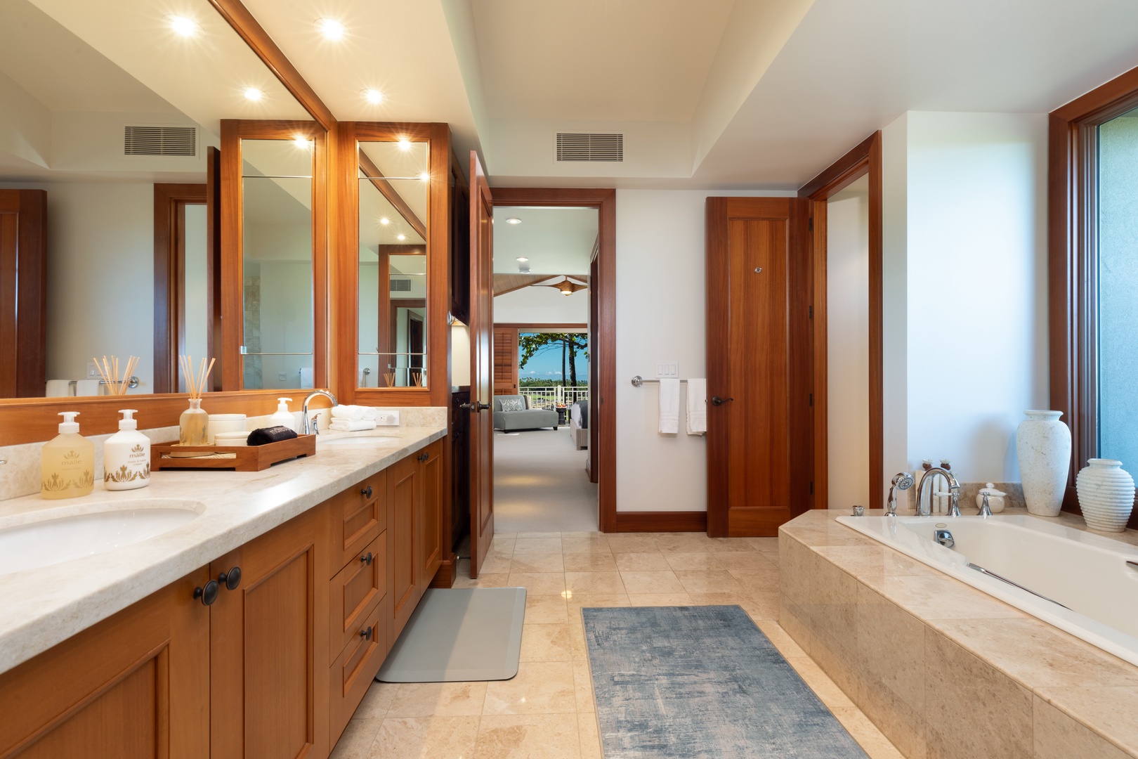 Kailua Kona Vacation Rentals, 3BD Waiulu Villa 111D at Hualalai Resort - Elegant bathroom with dual sinks, a soaking tub, and a walk-in shower for ultimate relaxation.