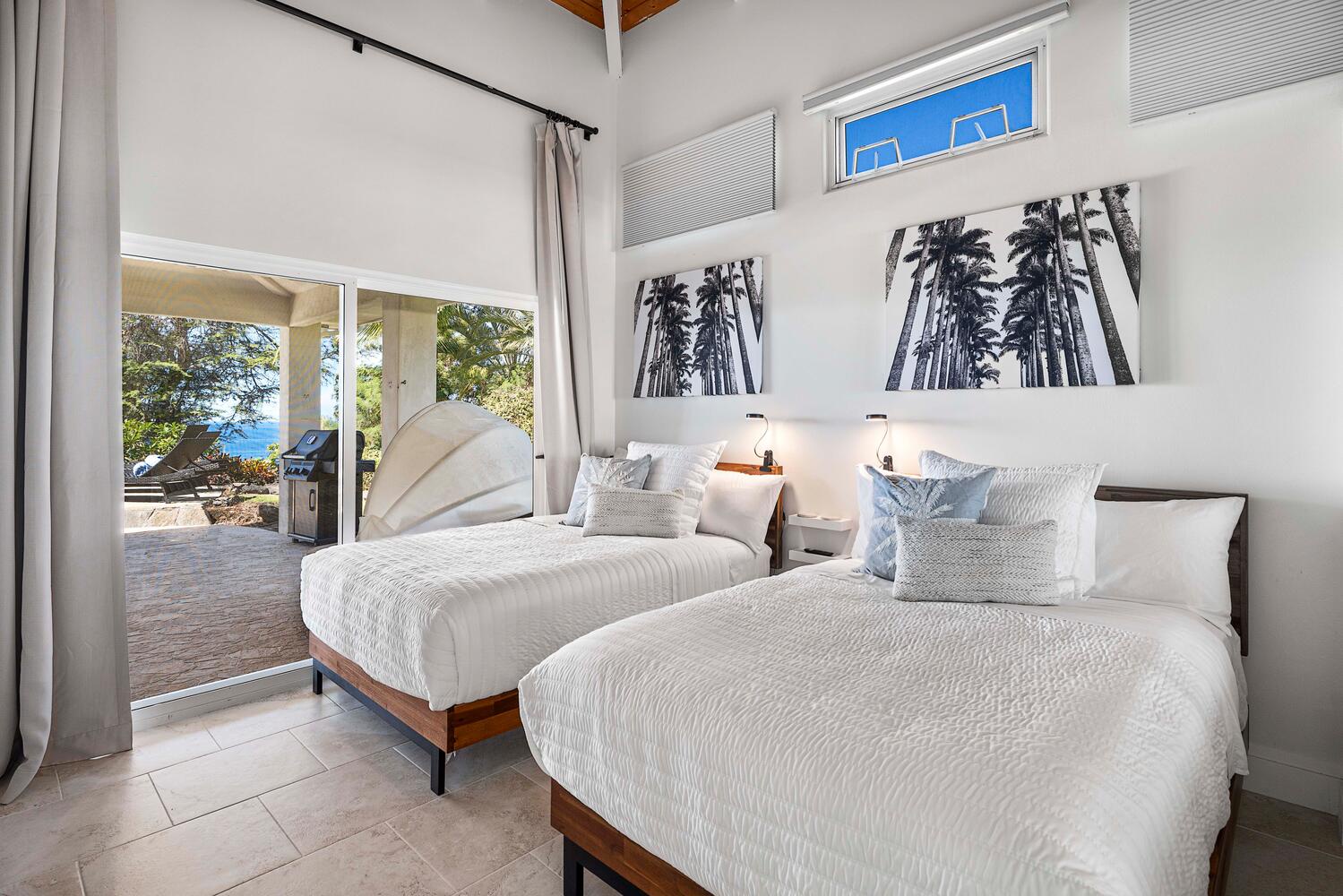 Kailua Kona Vacation Rentals, Ho'okipa Hale - Guest suite comes with two full-sized beds and an accent wall of tropical-inspired art.