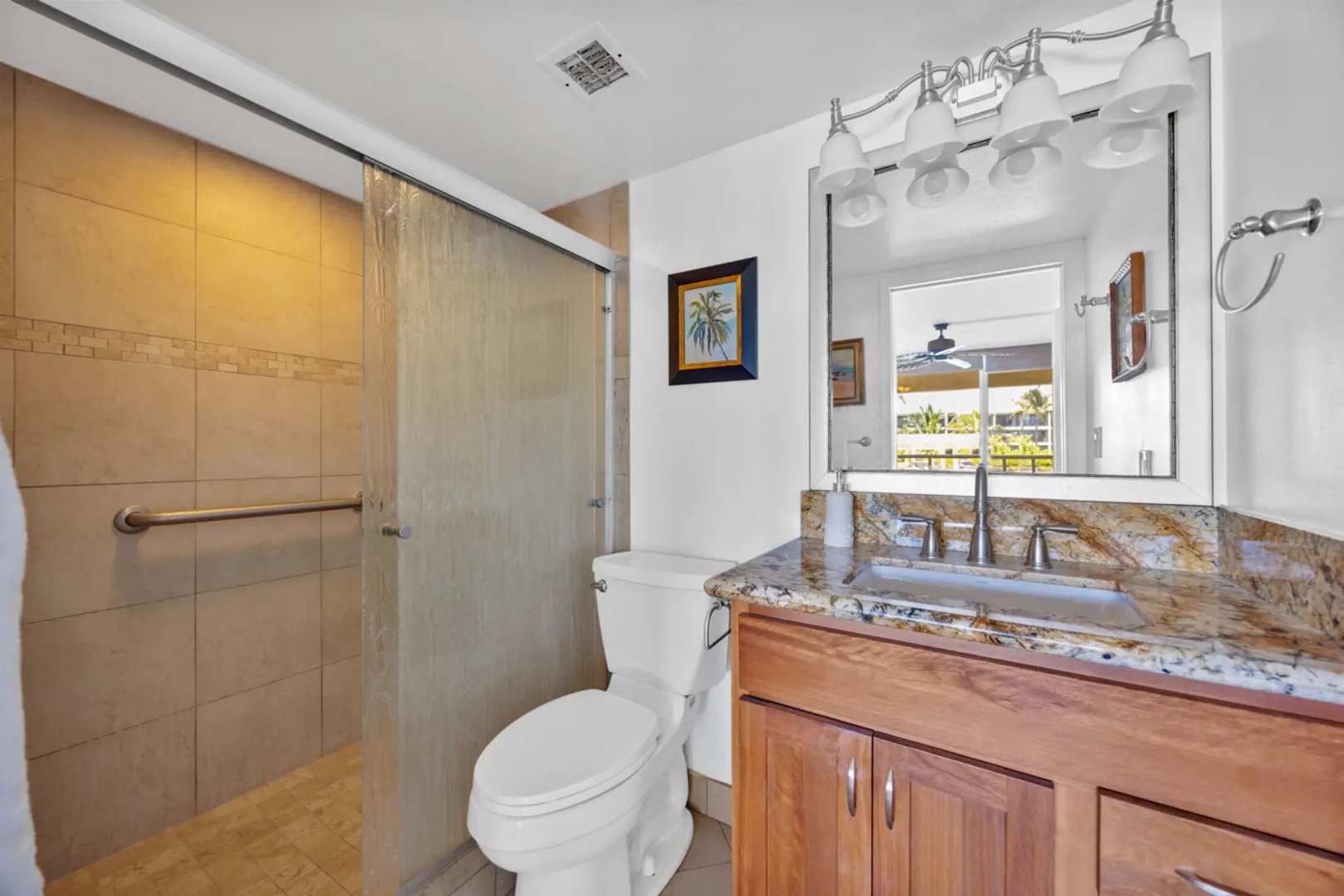 Kihei Vacation Rentals, Maui Banyan H306 - Bright and inviting, this bathroom features a walk-in shower and plenty of light to start your day refreshed.