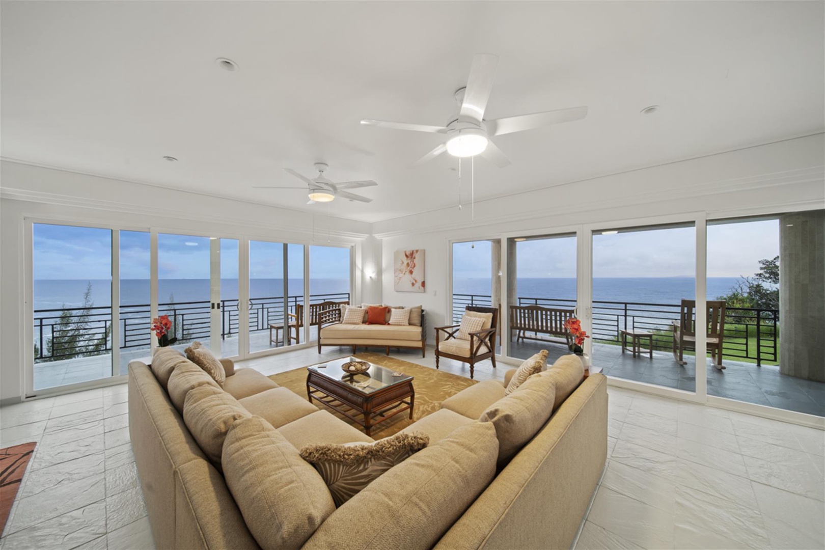 Ninole Vacation Rentals, Waterfalling Estate** - Wider view of great room and deck seating.