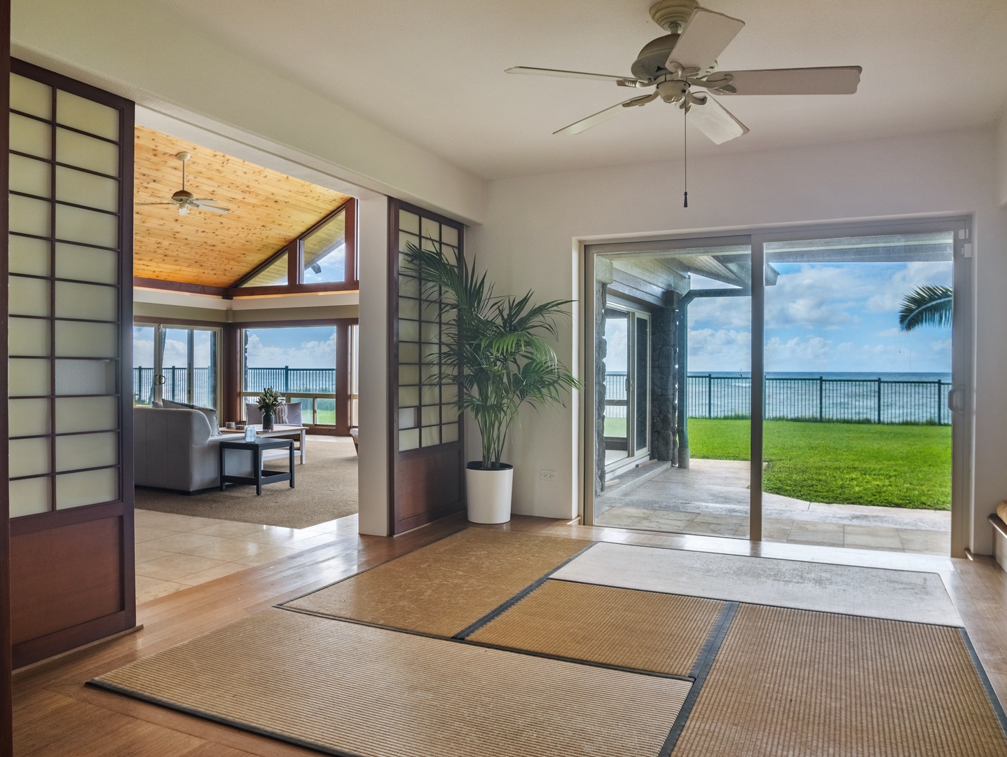Waianae Vacation Rentals, Konishiki Beachhouse - Open sliding doors invite you to a seamless indoor-outdoor living experience with ocean views.