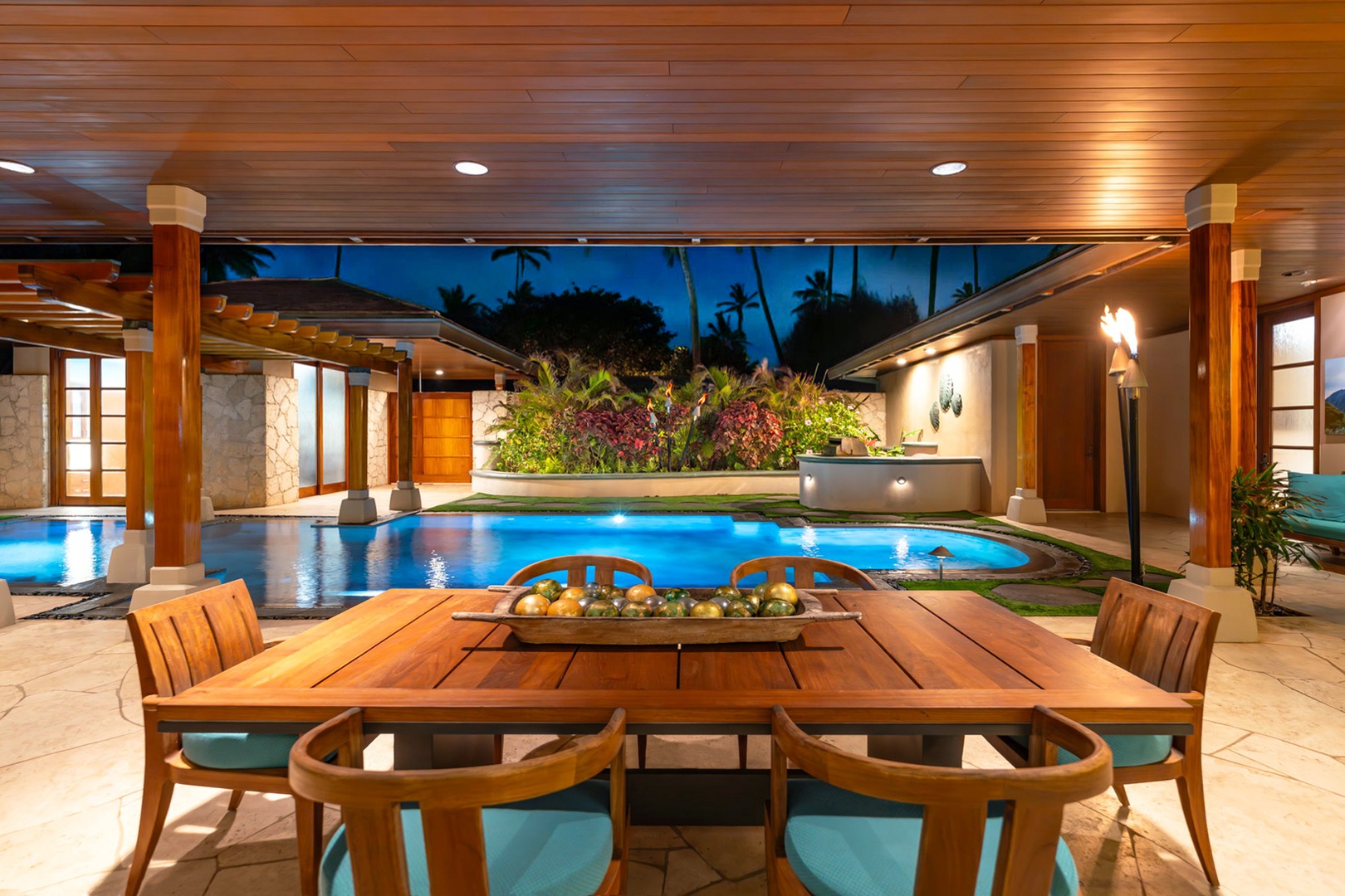 Kailua Vacation Rentals, Kailua Sands - Covered poolside dining with lush landscaping.