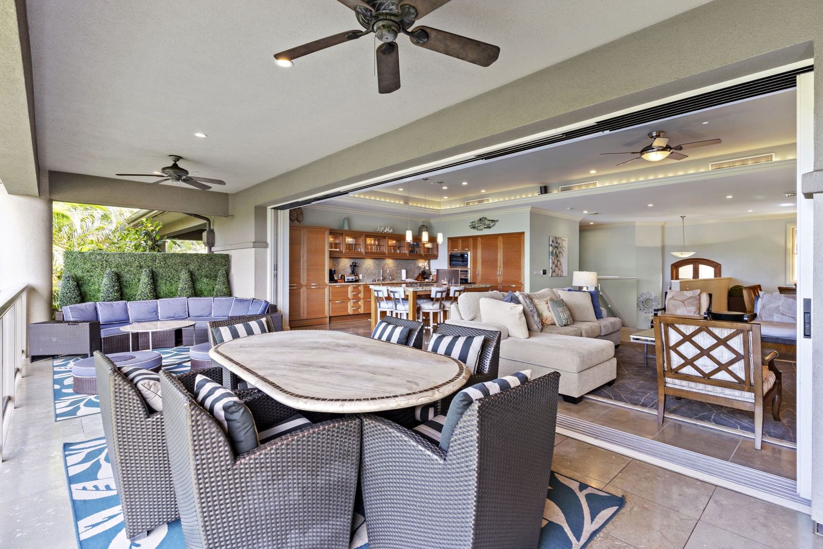 Wailea Vacation Rentals, Wailea Luxury Residence Hoolei 93-3 - Seamless indoor-outdoor living with a spacious lanai, comfortable dining area, and cozy seating flowing into the open-concept living and kitchen space