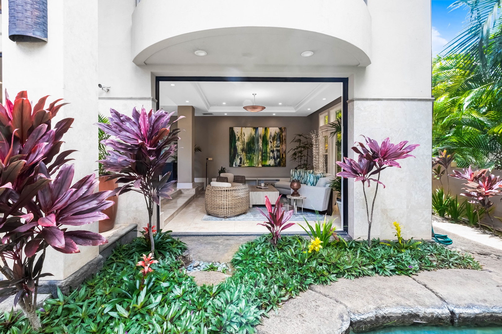 Honolulu Vacation Rentals, Pili Pono - Lush tropical entry path leading to the villa’s grand entrance.