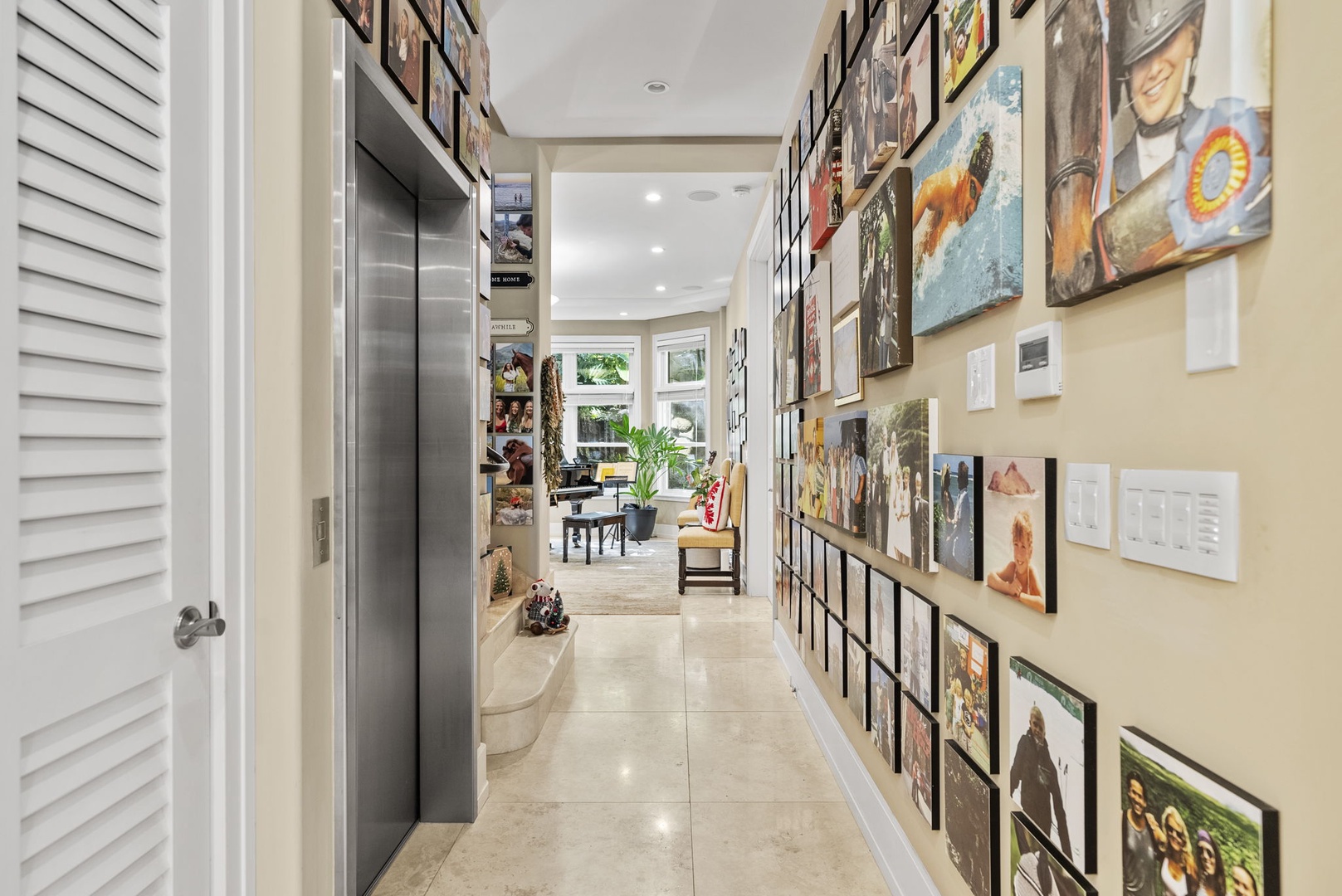 Honolulu Vacation Rentals, Pili Pono - Hallway showcasing unique artwork and leading to living areas.