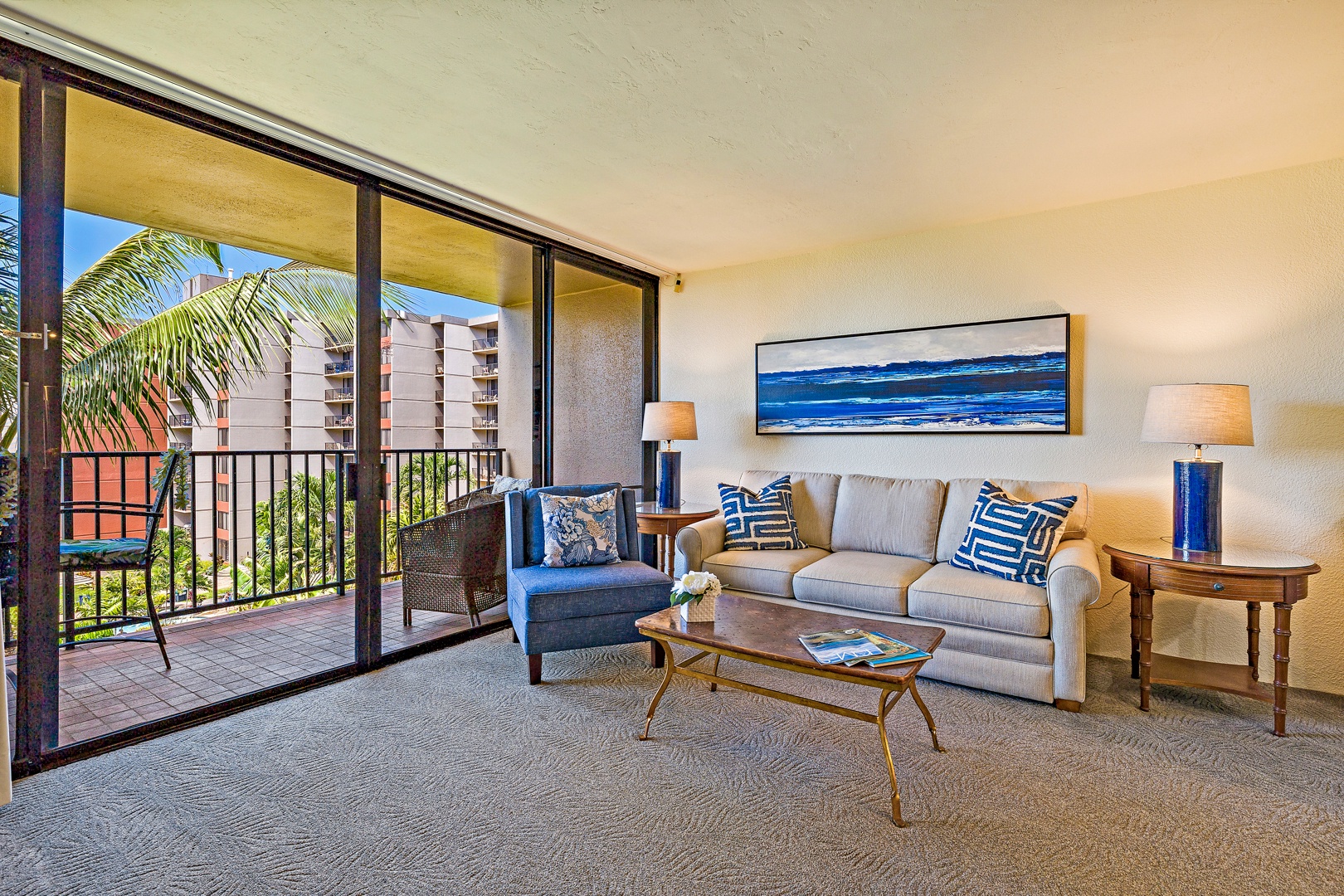 Lahaina Vacation Rentals, Kaanapali Shores 544 - This cozy living room invites you to relax and unwind, featuring comfortable seating with a tropical view through the large sliding glass doors