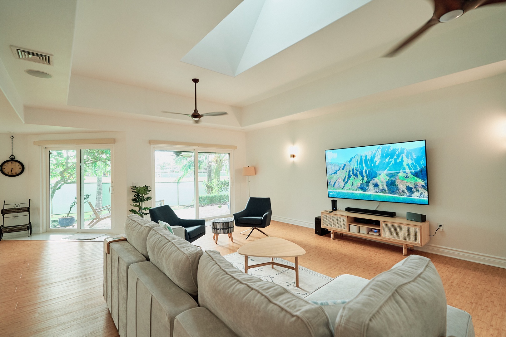 Princeville Vacation Rentals, Hale Kai - Unwind in your bright living space with plush seating and mountain views on the big screen.