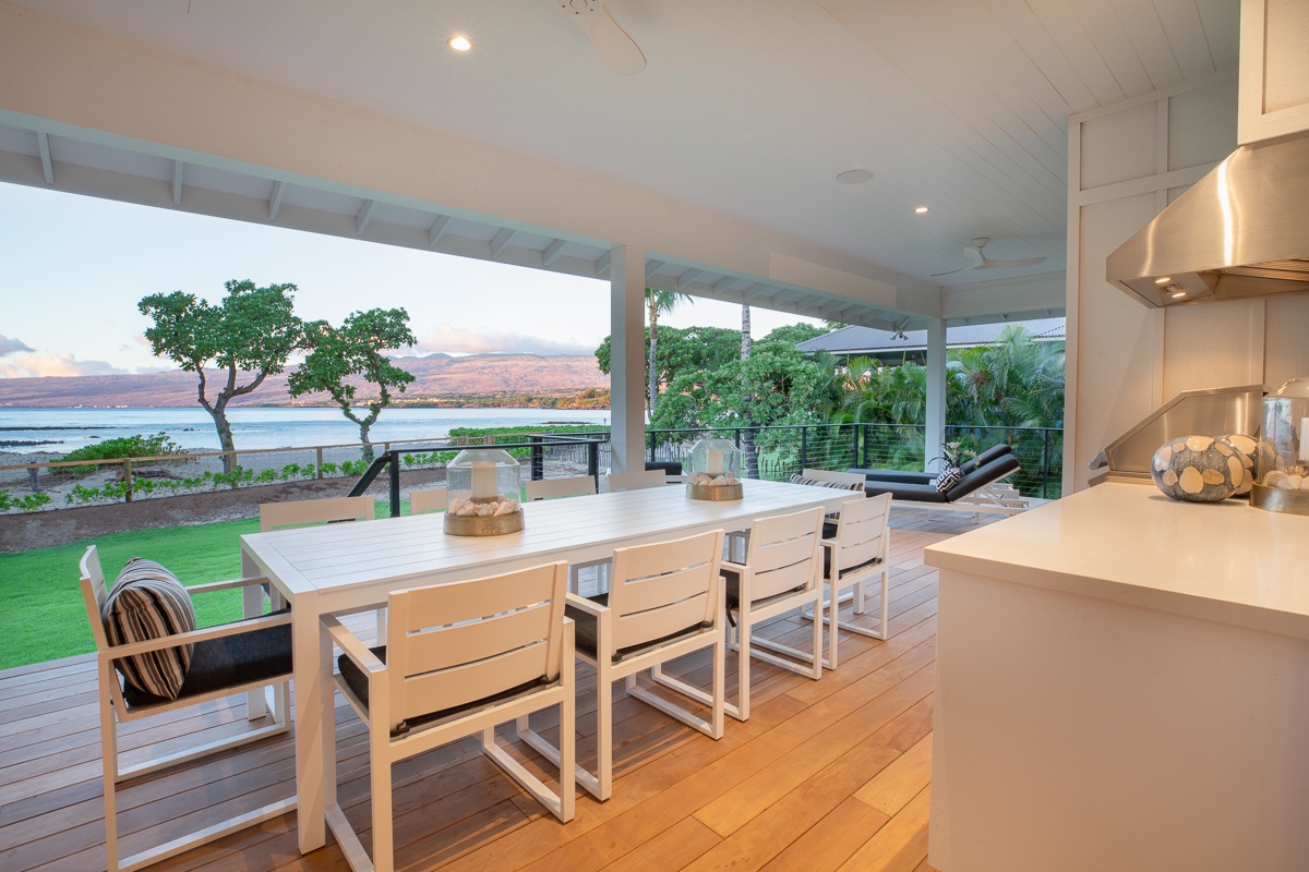 Kamuela Vacation Rentals, Puako Beach Getaway - Gather around a stylish dining table that comfortably seats eight, perfect for hearty meals and lively conversations.