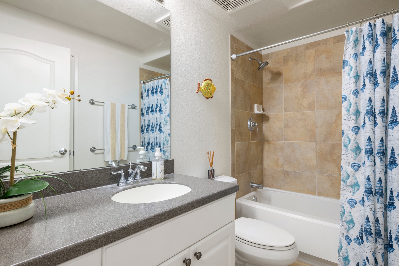 Kapolei Vacation Rentals, Ko Olina Kai 1059F - Refresh in your bright bathroom with coastal touches and modern amenities for a comfortable stay.
