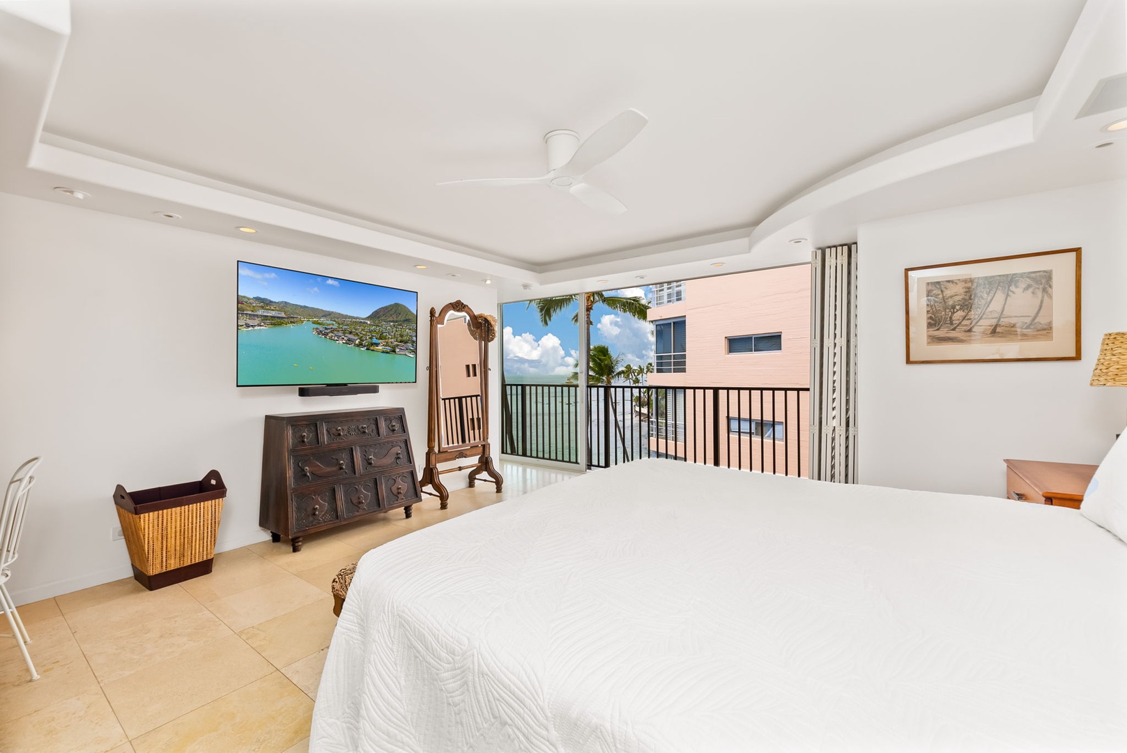 Honolulu Vacation Rentals, Kaimana Views - Bedroom with private balcony access, allowing fresh air and natural light to create a relaxing, open atmosphere.