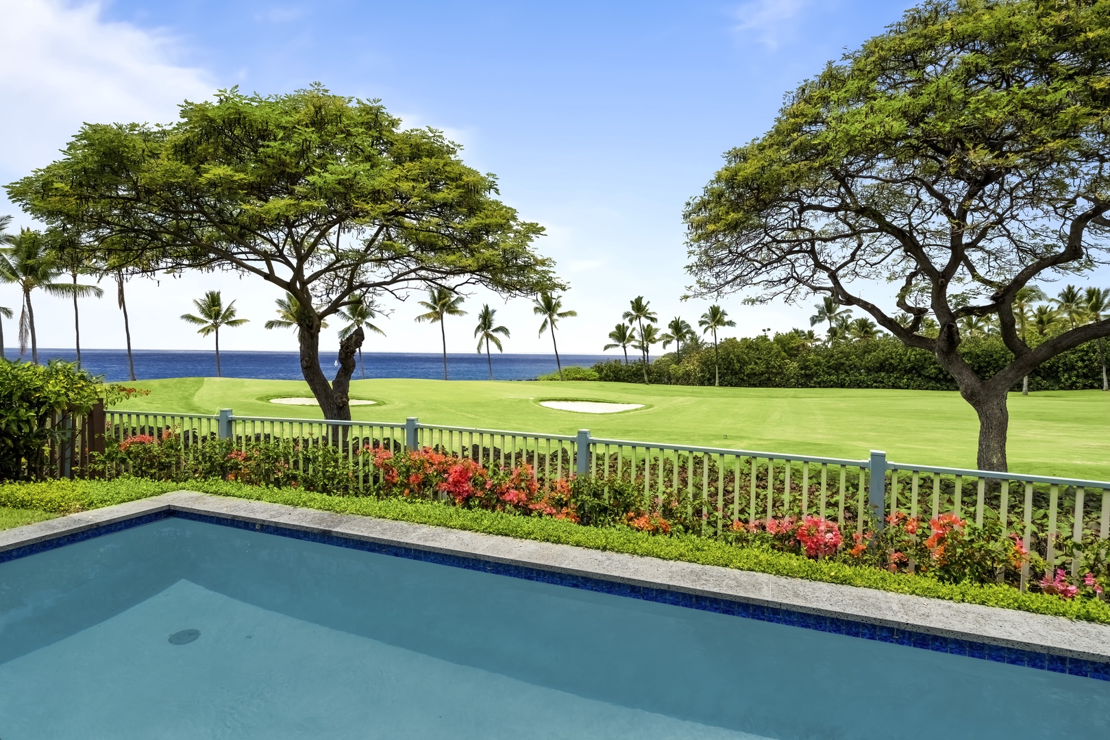 Kailua Kona Vacation Rentals, Holua Kai #27 - The fairway greens and a shade tree fill the view from the water.